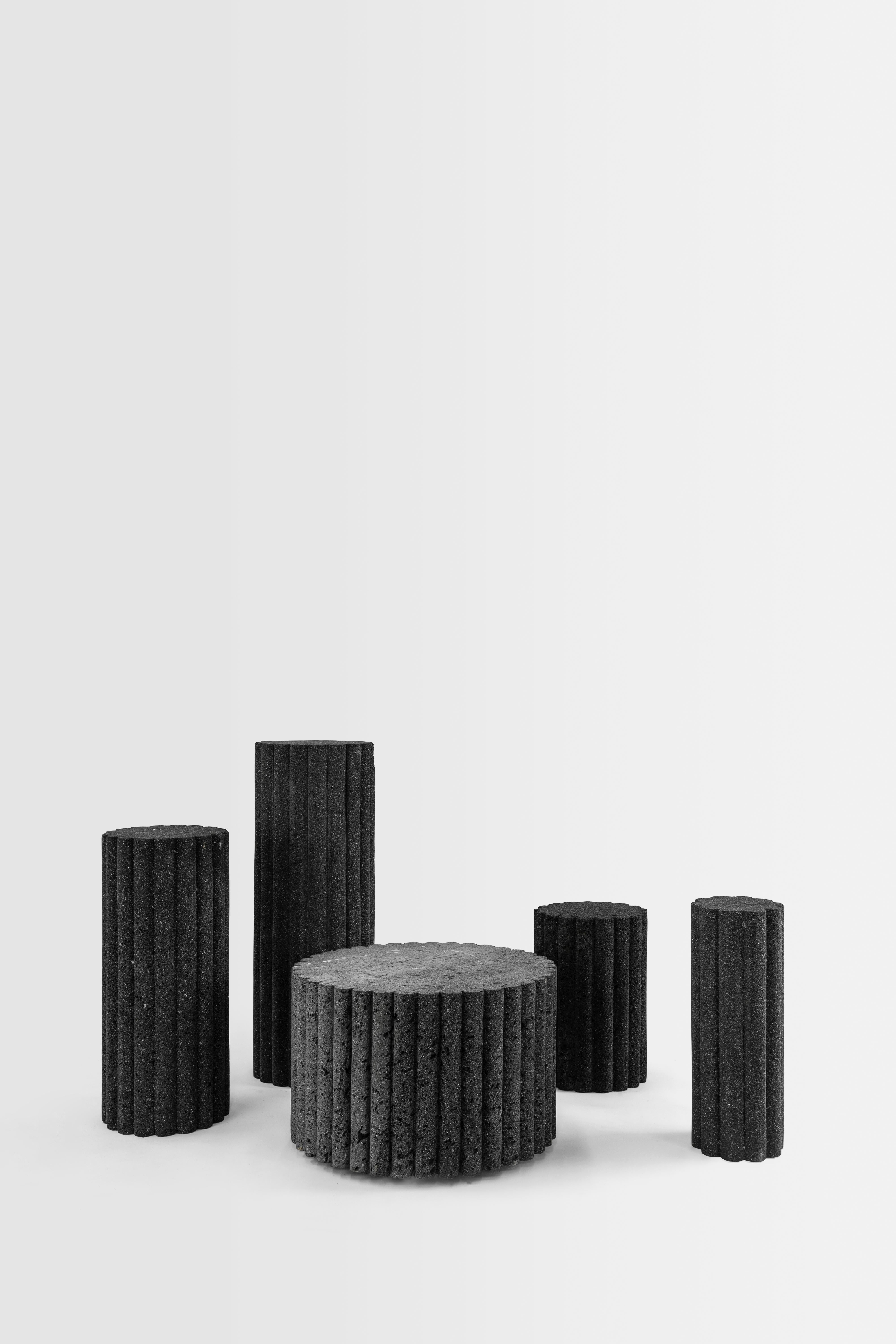The LOTO ROCA TOTEMS are exploration personified. These volcanic stone monoliths have been carved mastering a meditative process with chisel and hammer. Two totems rise to different heights recalling the esthetic character of the LOTO ROCA family as