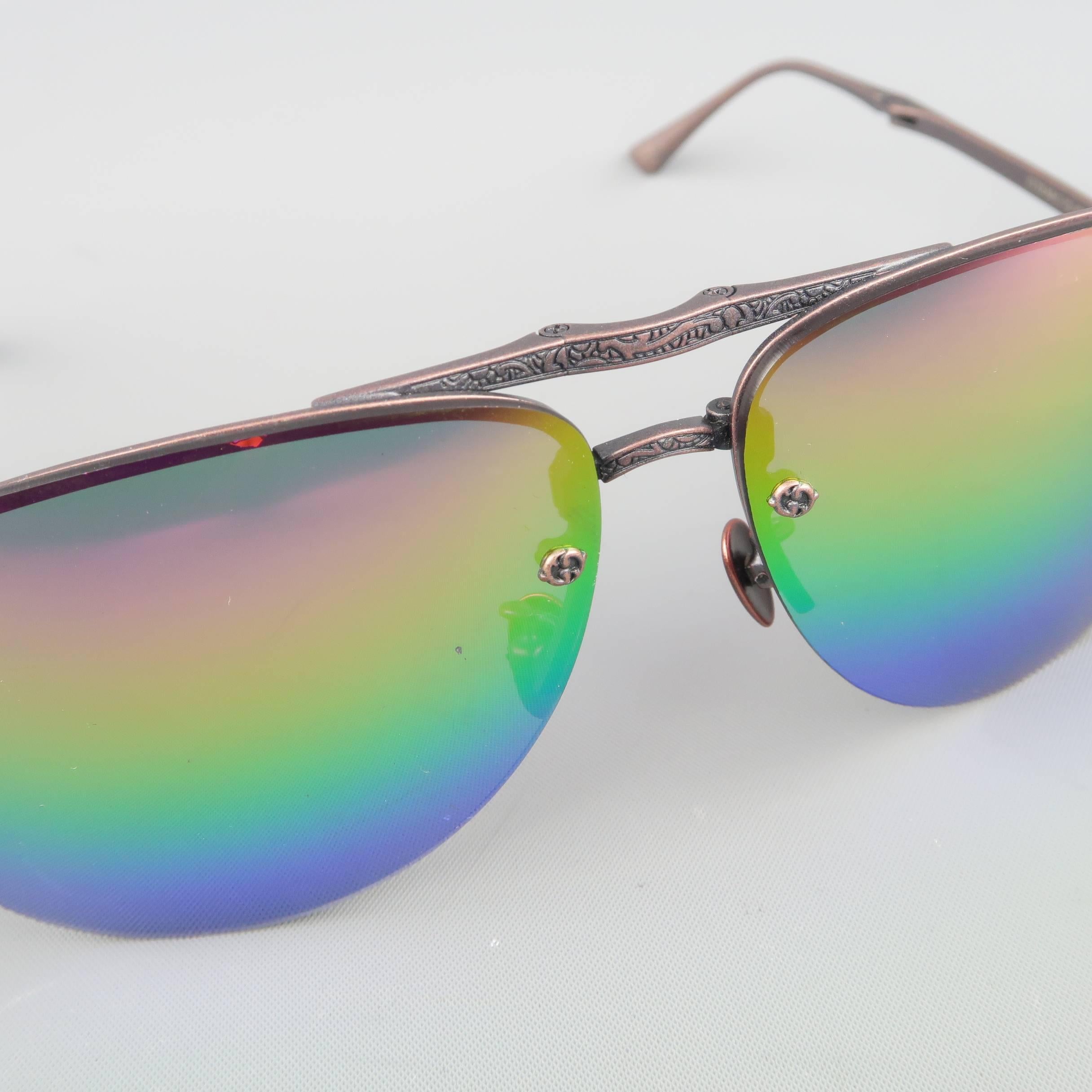LOTOS aviators come in ornate engraves copper tone titanium with metallic rainbow gradient lenses and fold up construction. Handmade in  Germany.
 
Good Pre-Owned Condition.
Marked: LT23 64 12-137
 
Measurements:
 
Length: 13.5 cm.
Height: 5.5 cm.