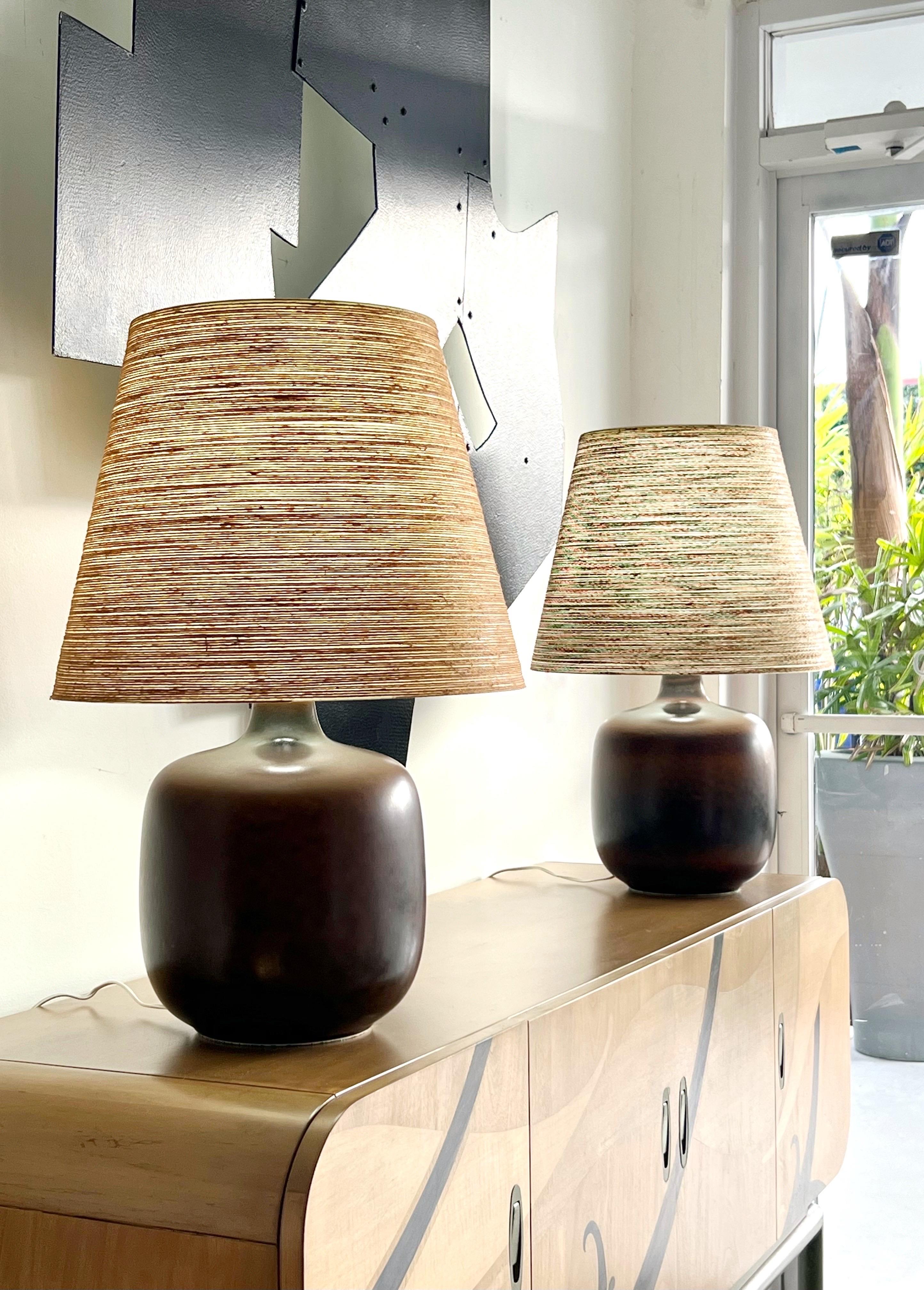 A pair of lamps by Lotte and Gunnar Bostlund. Total height is 25.5,” diameter of shade is 16.5.” 