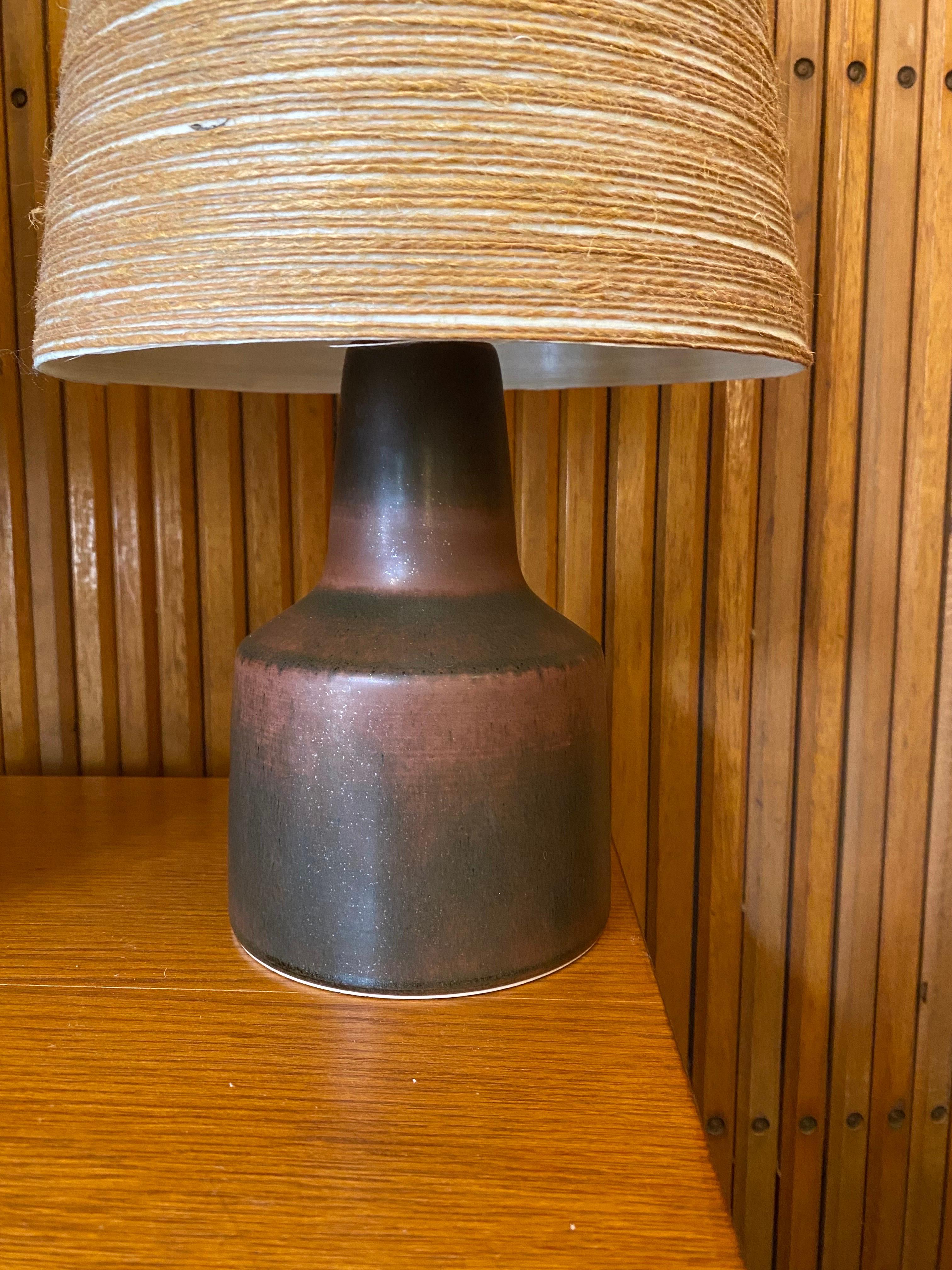 Pair of Lotte and Gunnar Bostlund Table lamps with their Original shades!  Fiberglass with wrapped string give an amazing quality of light!  Always a plus to find these with their original shades!  Ceramic bodies in very nice shape!