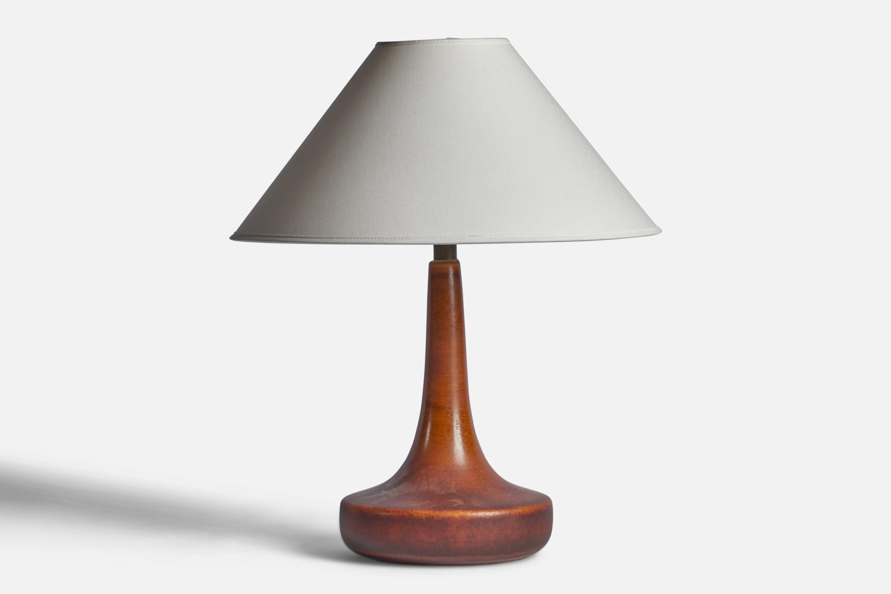 A brown-glazed ceramic and brass table lamp designed and produced by Lotte and Gunnar Bostlund, Canada, 1960s.

Dimensions of Lamp (inches): 14.75” H x 5.85” Diameter
Dimensions of Shade (inches): 4.5” Top Diameter x 16” Bottom Diameter x 7.25”