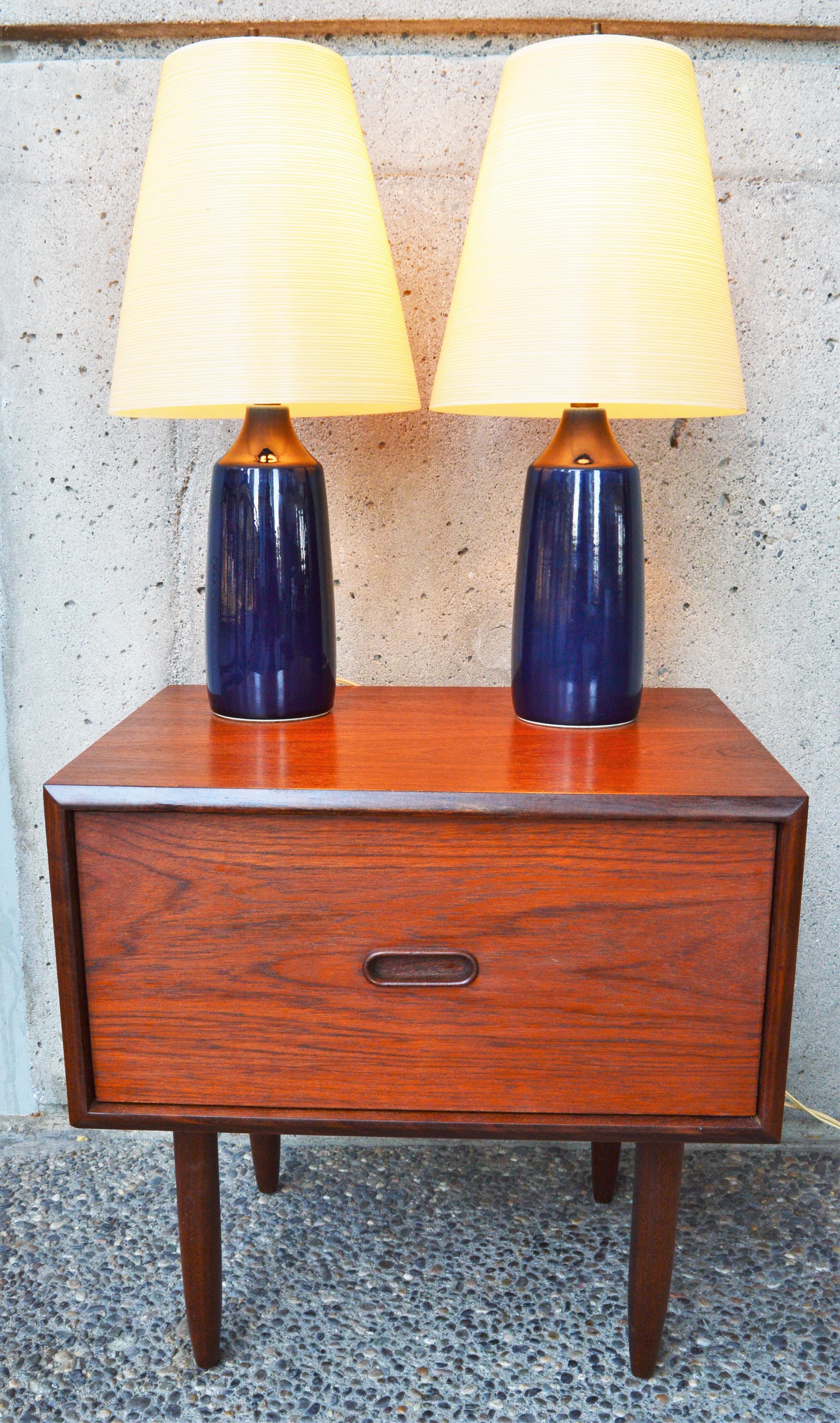 This hot pair of cobalt blue Danish Modern lamps were made by Lotte & Gunnar Bostlund. If you're not familiar with the stunning ceramic lamps designed and created by Lotte & Gunnar Bostland, originally of Denmark but who relocated their business to