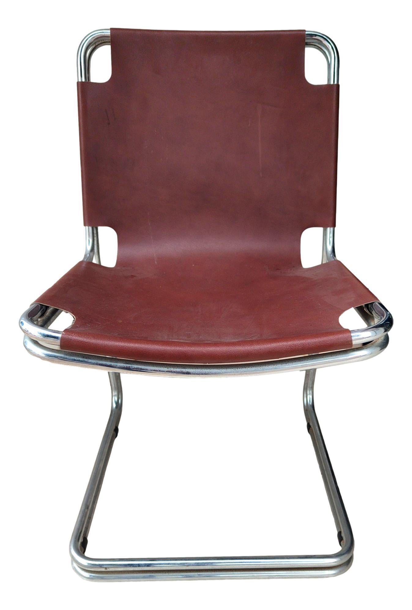 lot of four original 1970s Italian-made chairs designed in the style of Pascal Mourgue or Gastone Rinaldi,  metal and brown leather. 
They measure cm 85 in height, cm 45 in width, cm 55 in depth and cm 45 in seat height from the floor.
Very good