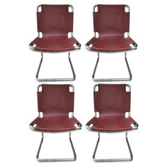 Vintage lot of four metal and leather chairs in the style of Pascal Mourgue 1970s
