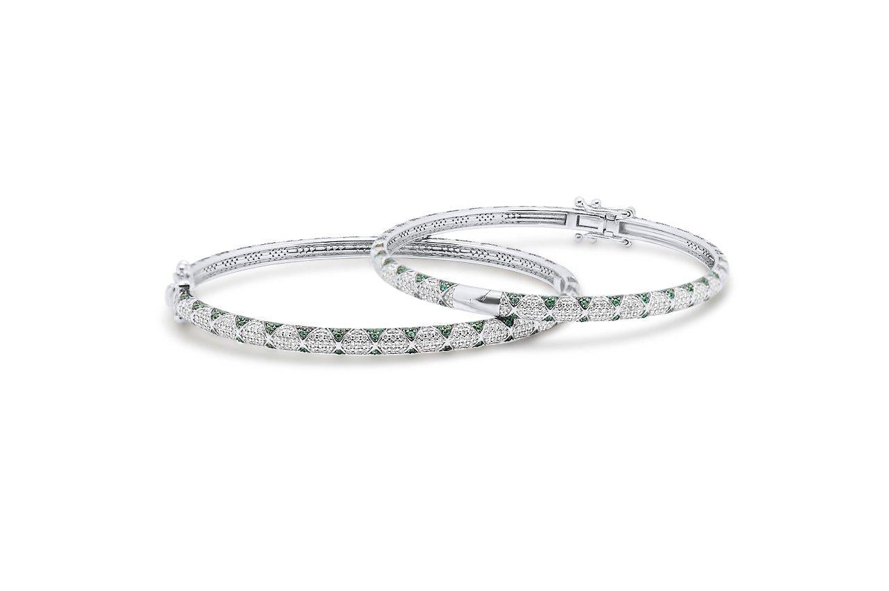 Bangle in 14k White Gold. These bangles include pave set emerald petals in a lotus motif and pave set white diamonds and are part of Rinoor’s Lotus collection. They can be mixed and matched and paired with rings, earrings and necklaces from the same