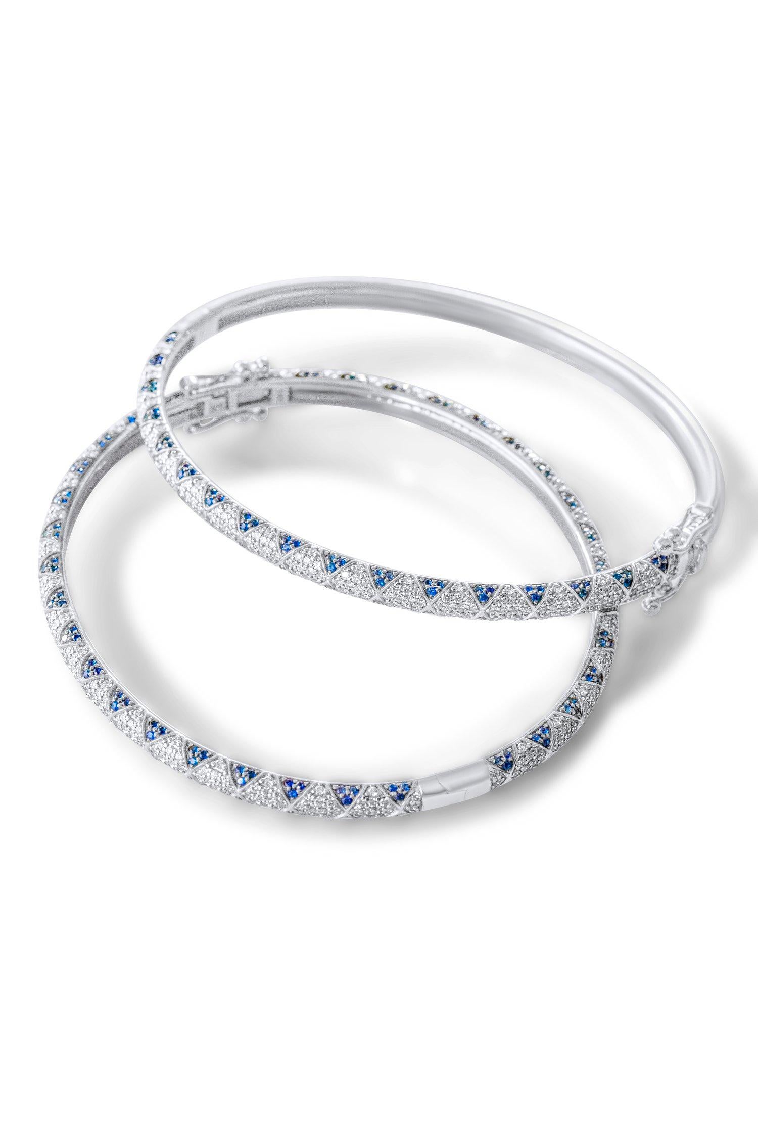 Bangle in 14k White Gold. These bangles include pave set emerald petals in a lotus motif and pave set white diamonds and are part of Rinoor’s Lotus collection. They can be mixed and matched and paired with rings, earrings and necklaces from the same