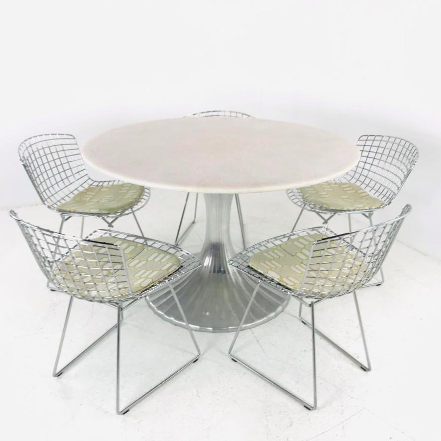 This elegant lotus table features a silver finish base with gorgeous round quartz top.