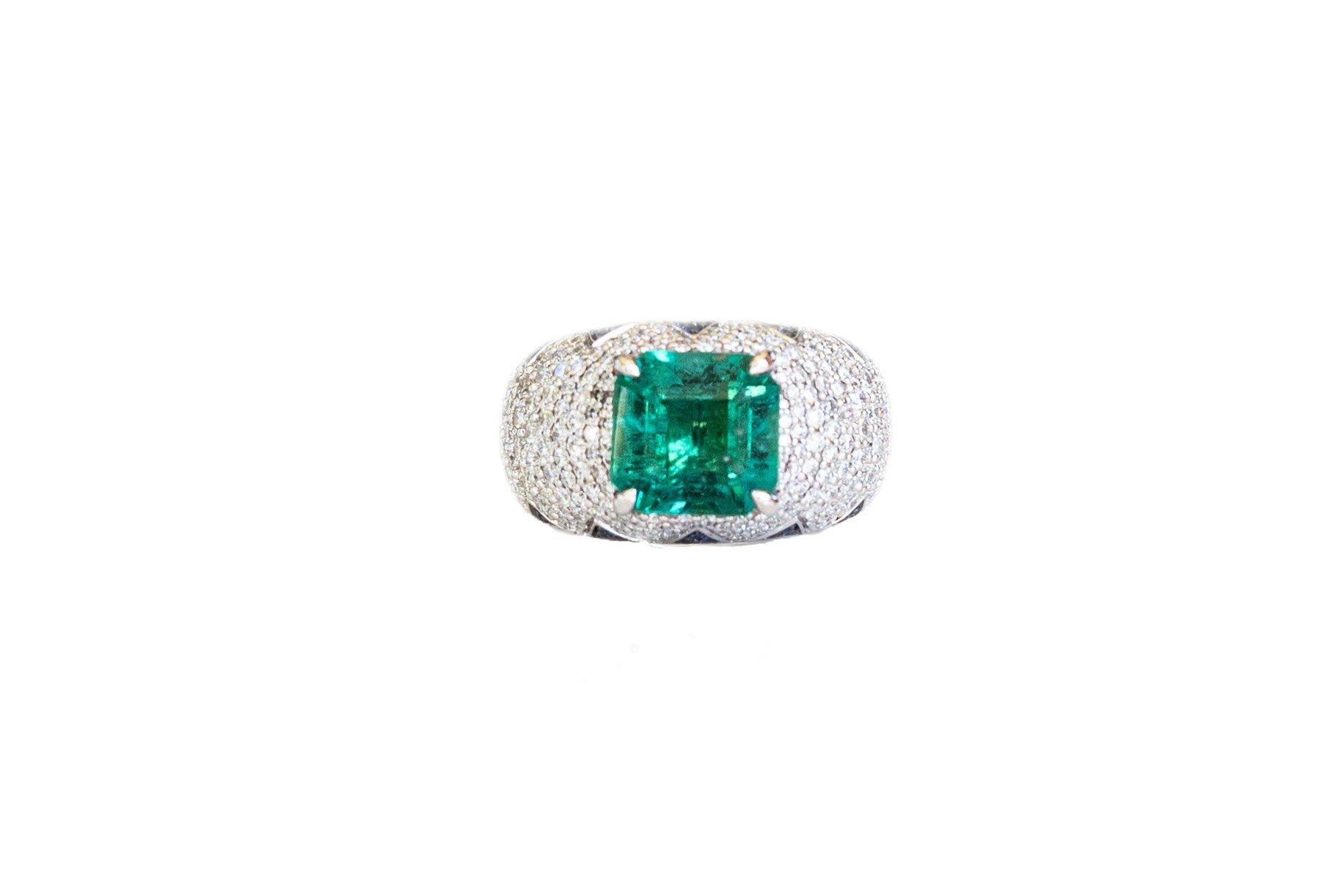 8k White Gold. These any-finger rings include a dazzling square emerald solitaire of approximately 3.75 cts, pave set blue sapphire petals in a lotus motif and pave set brilliant cut white diamonds. Rinoor's re-imagined rings, are incredibly