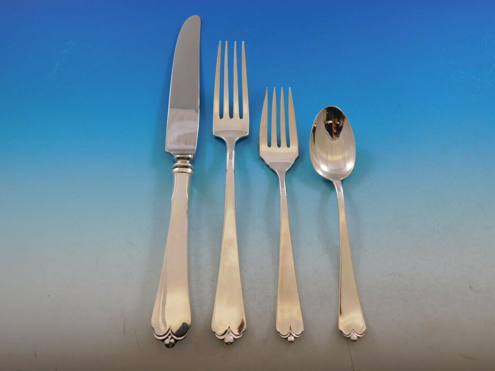 Dinner size lotus by Watson-Wallace circa 1935 sterling silver flatware set, 88 pieces. This set includes:

12 dinner size knives, 9 3/4