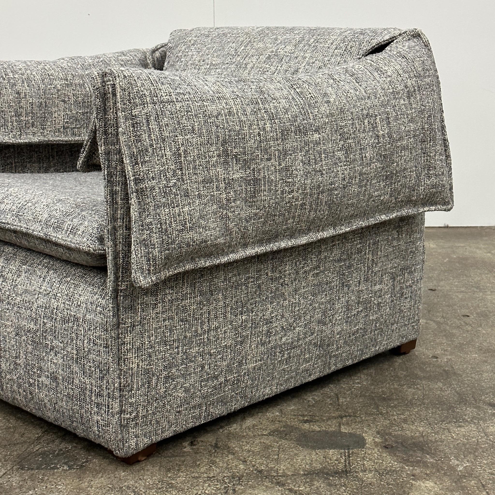 c. 1970s. Reupholstered in grey/white chenille. Matching loveseat available. Made in Denmark. Removable arms.