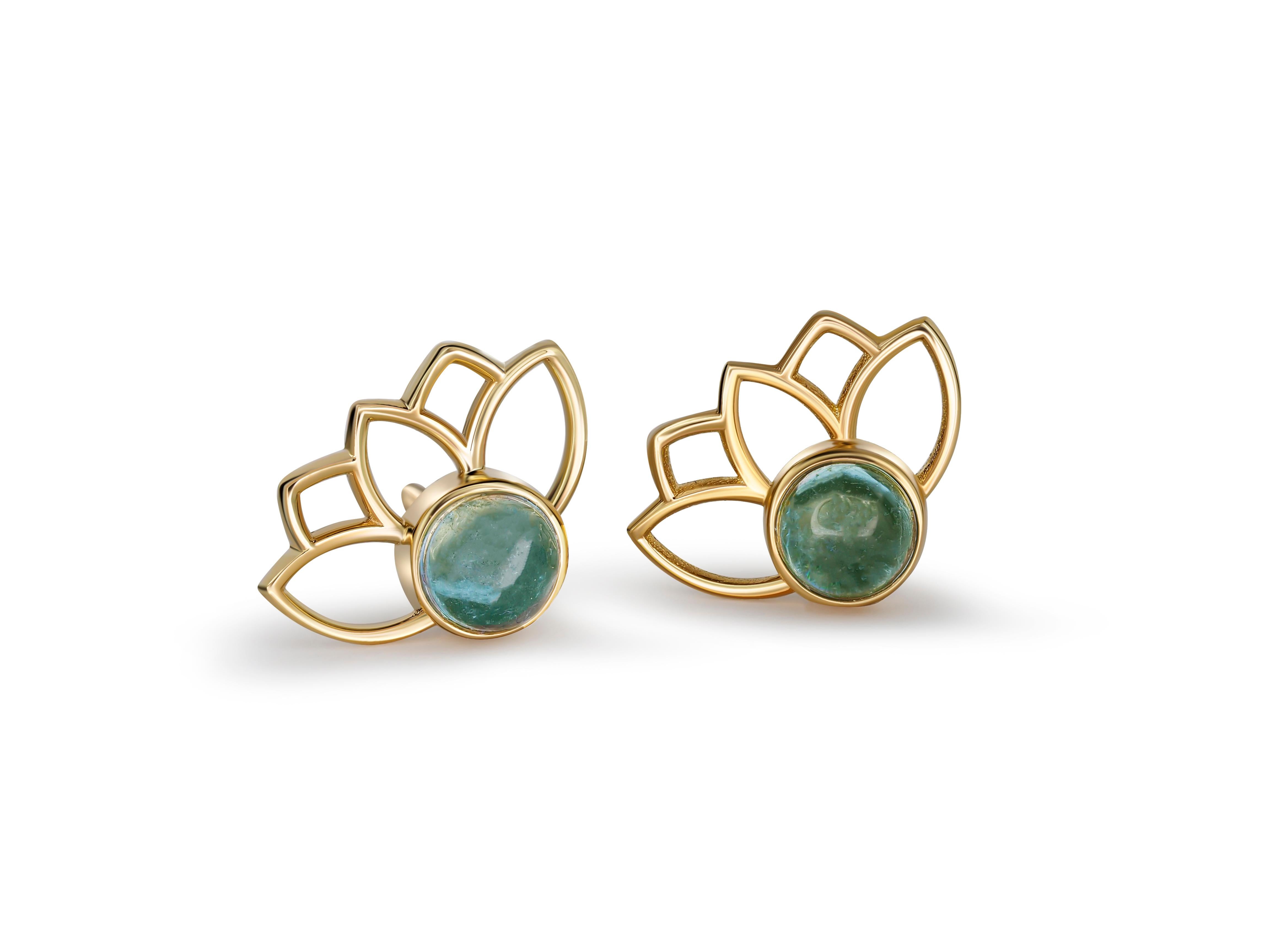 Lotus earrings studs with aquamarines in 14k gold. Aquamarine cab earrings 

Metal: 14 karat gold
Weight: 1.2 g.
Size: 11.45 x 8.35 mm.
Set with genuine  aquamarines: weight - 0.45 ct x 2 = 0.90 ct total.
Light blue color, cabochon cut, clarity good