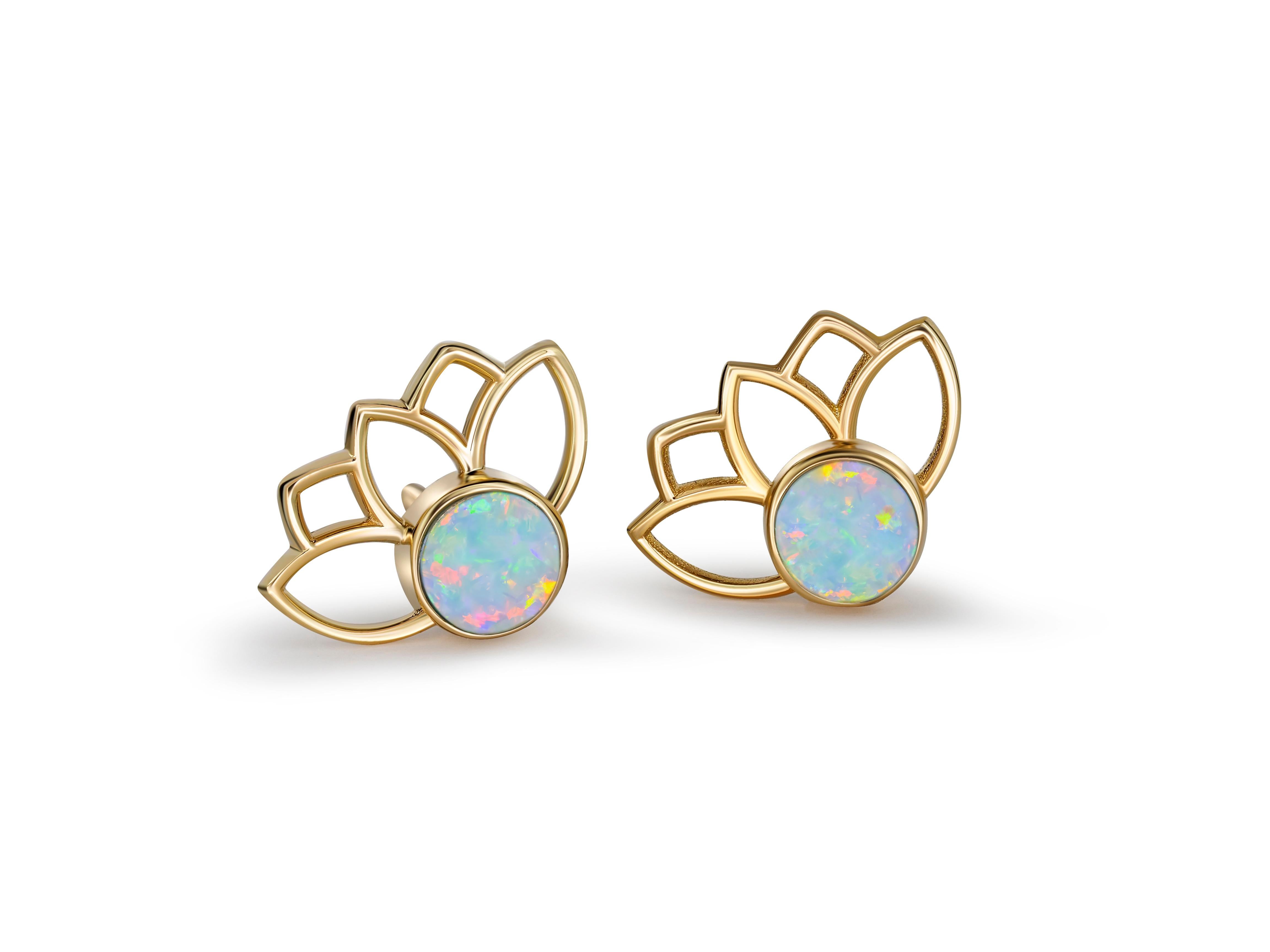 Lotus earrings studs with opals in 14k gold.  Opal cabochon earrings.  Opal Gold Earrings. Flower gold earrings. Round  cab opal earrings studs. Everyday earrings with opals. Flower gold earrings.

Metal: 14 karat gold
Weight: 1.5 g.
Size: 11.45 x