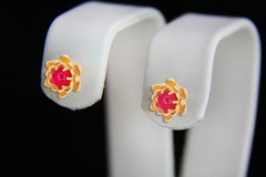 Lotus earrings studs with rubies in 14k gold.