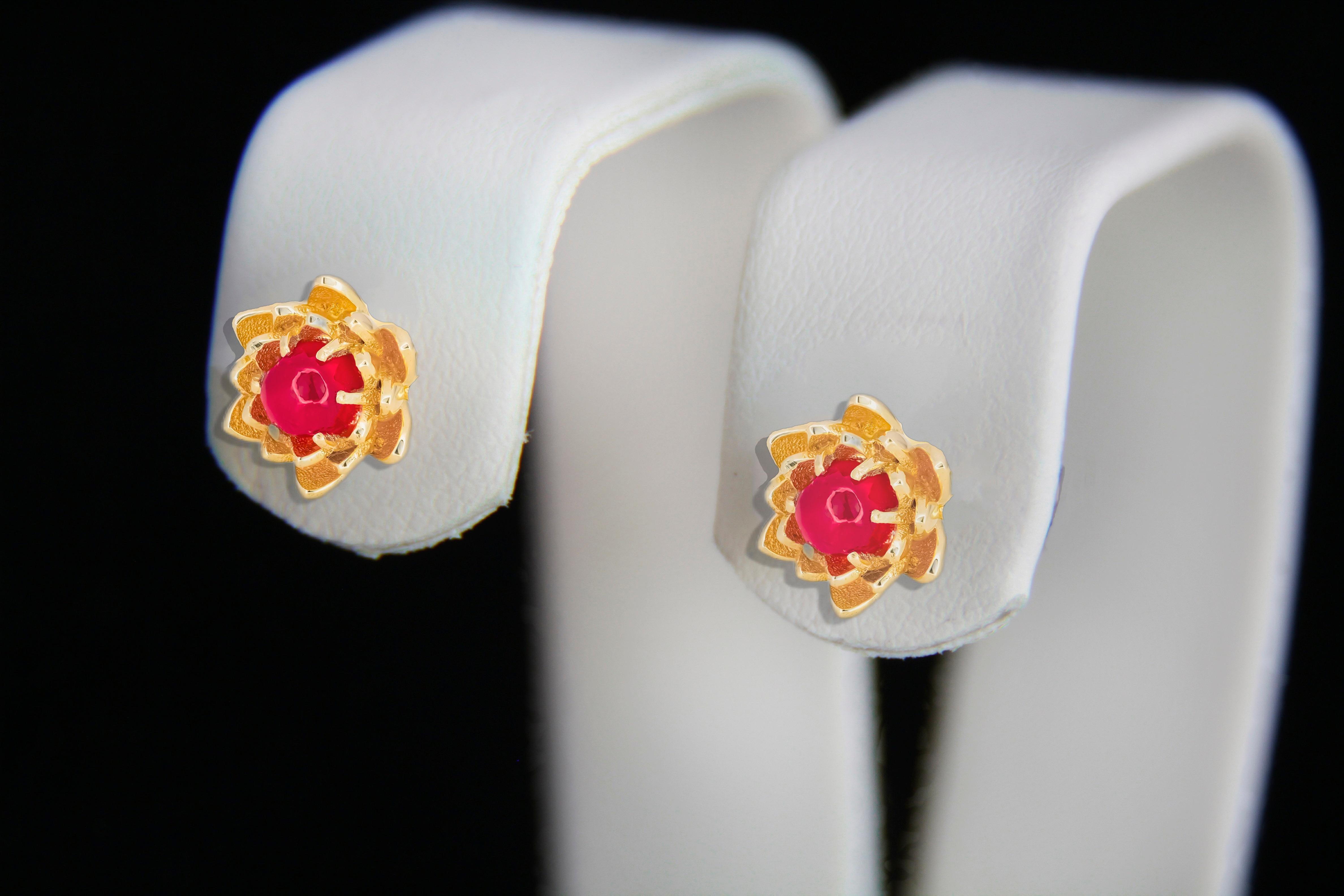 Lotus earrings studs with rubies in 14k gold. Ruby cabochon earrings. Ruby Gold Earrings. Flower gold earrings. Delicate ruby earrings.

Metal: 14k solid gold
Total weigh: 2.2 gr (depends from ring size)

Earrings:
Central stone: Rubies
Weight: 0.40