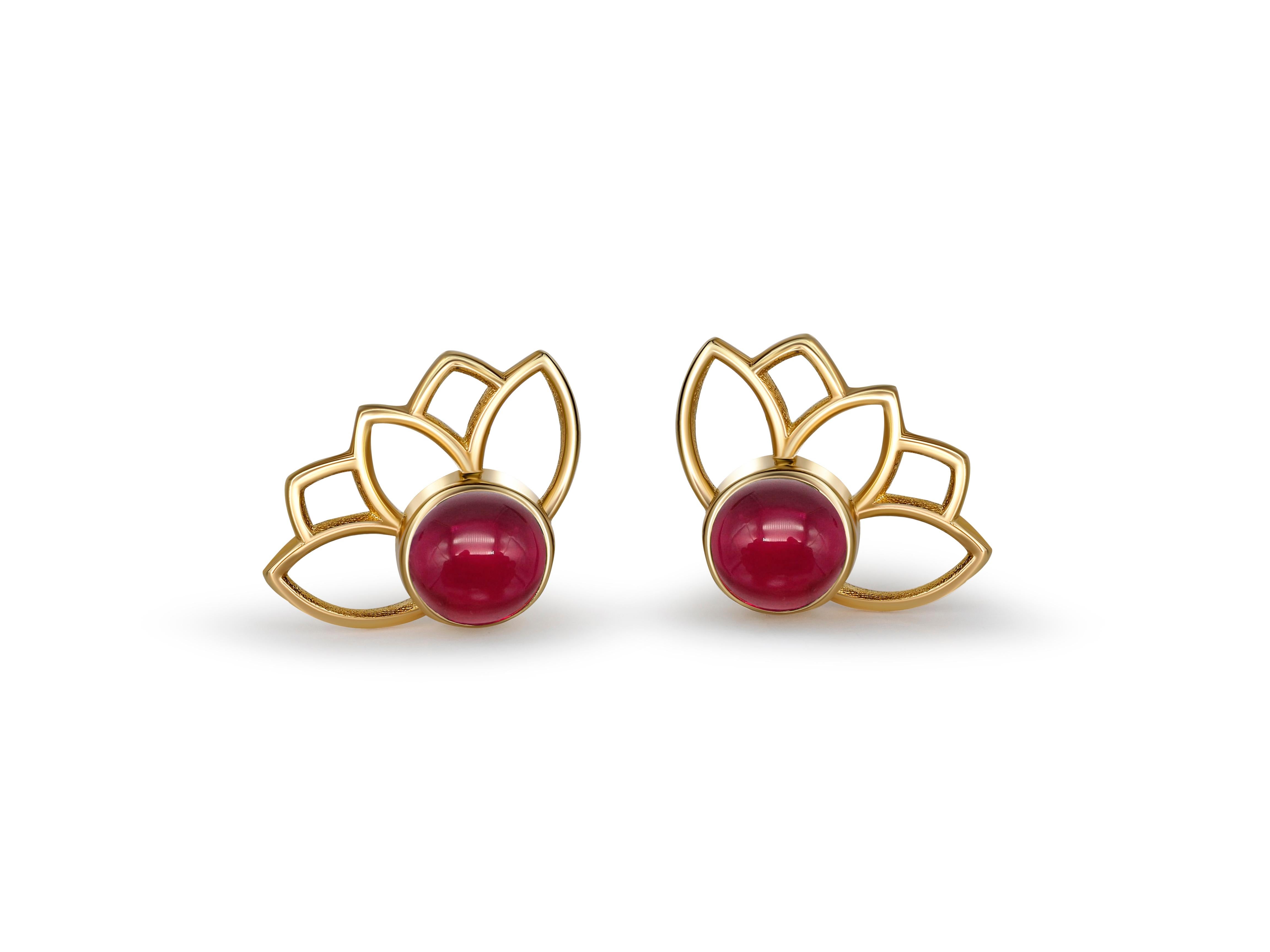 Lotus earrings studs with rubies in 14k gold. 

Ruby cabochon earrings. Ruby Gold Earrings. Flower gold earrings. Delicate ruby earrings.

Metal: 14 karat gold
Weight: 1.2 g.
Size: 11.45 x 8.35 mm.

Set with genuine  rubies: weight - 0.45 ct x 2 =