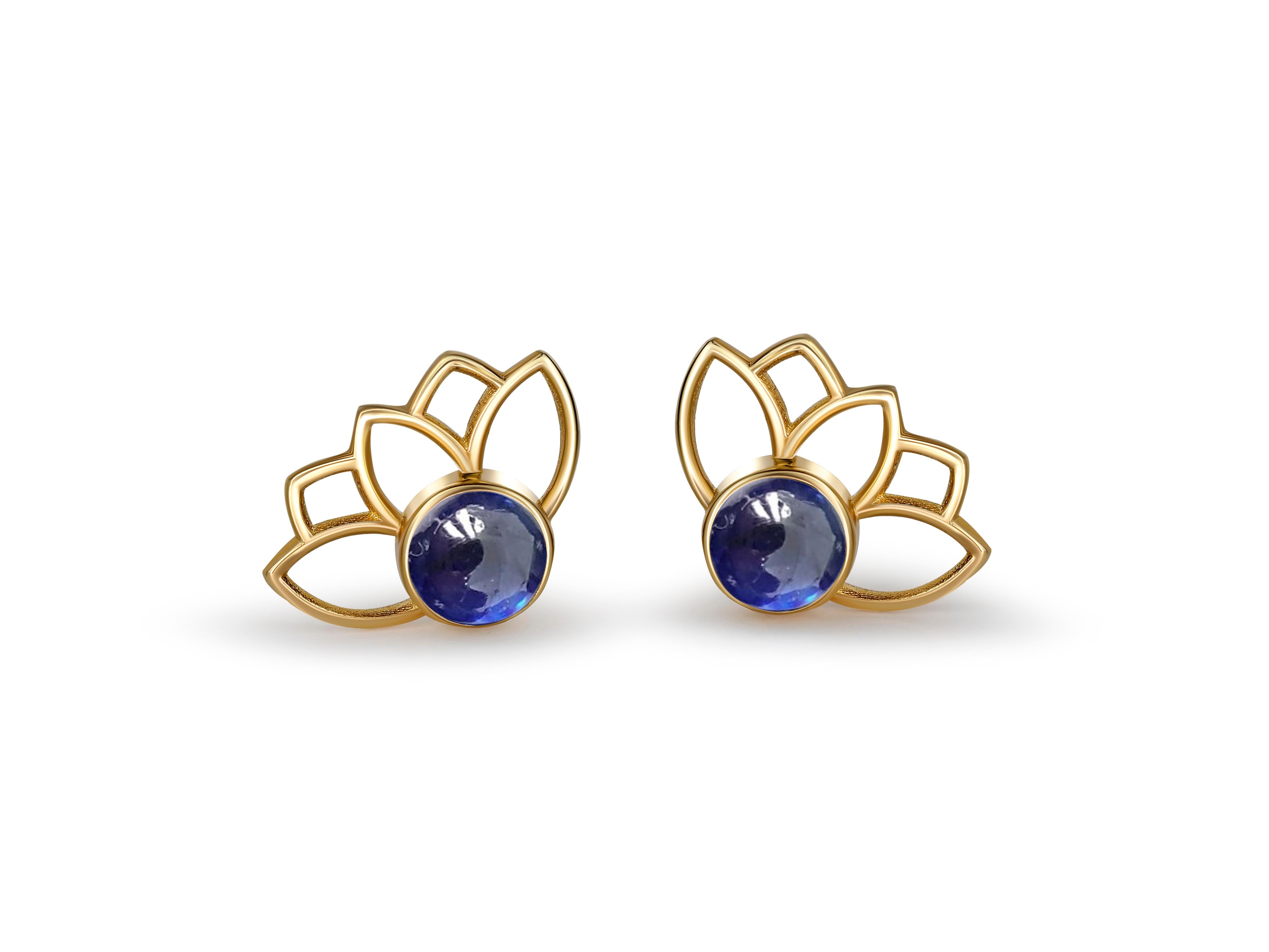 Lotus earrings studs with sapphires in 14k gold. 
Sapphire cabochon earrings. Blue sapphire Gold Earrings. Flower gold earrings.

Metal: 14 karat gold
Weight: 1.5 g.
Size: 11.45 x 8.35 mm.

Set with genuine  sapphires: weight - 0.45 ct x 2 = 0.90 ct