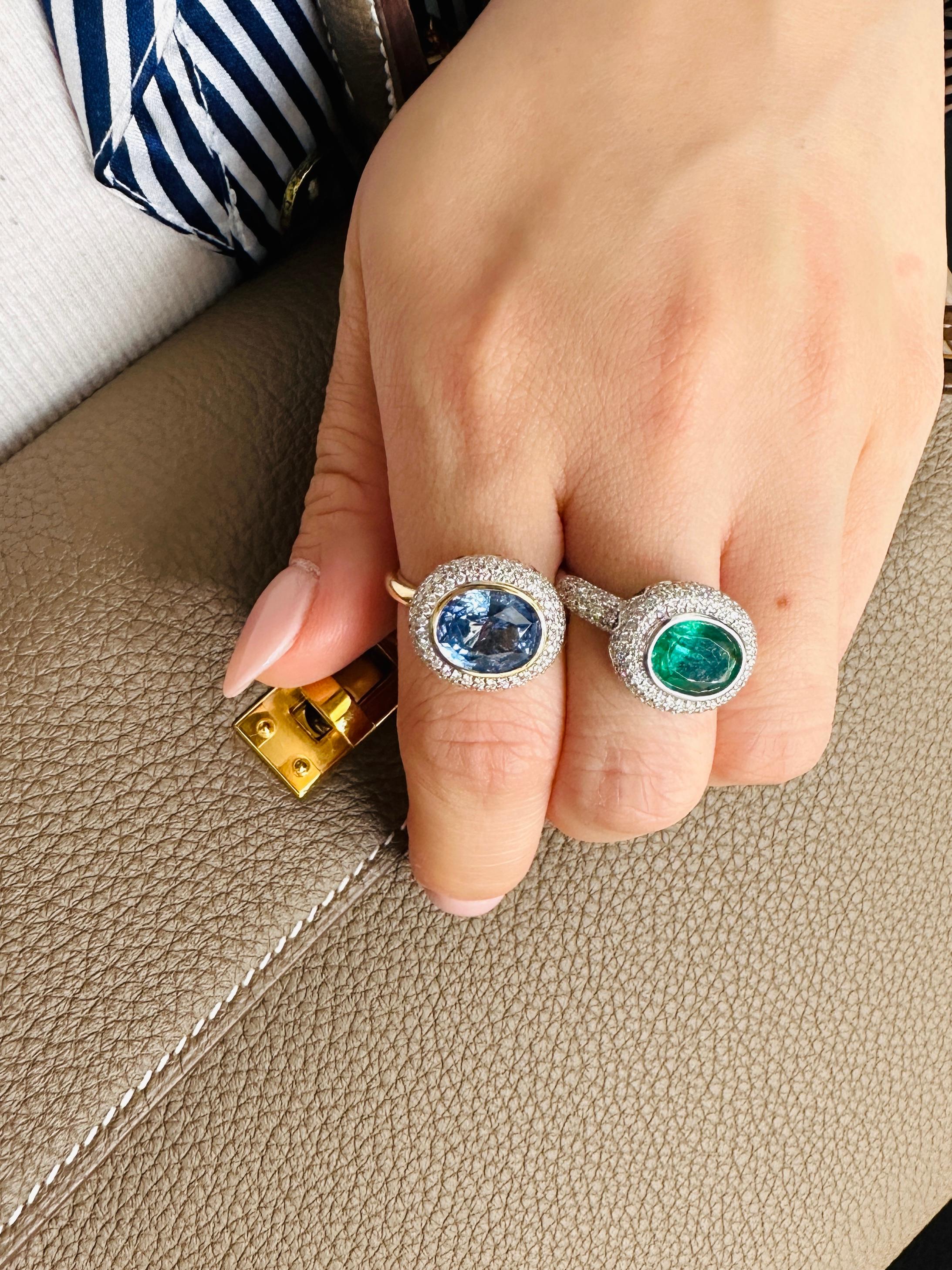 14k White Gold. These any-finger rings include a dazzling OVAL-shaped emerald solitaire of approximately 3ct, pave set blue sapphire petals in a lotus motif, and pave set brilliant cut white diamonds. Rinoor's re-imagined rings, are incredibly