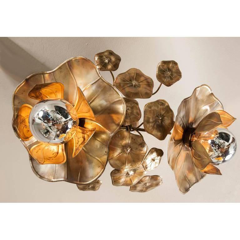 We have adapted our glamorous signature Lotus lights for the ceiling. They provide perfect mood lighting either singly or in clusters. Made in solid brass and soldered with silver, each piece is unique and individually handcrafted. Exclusive to