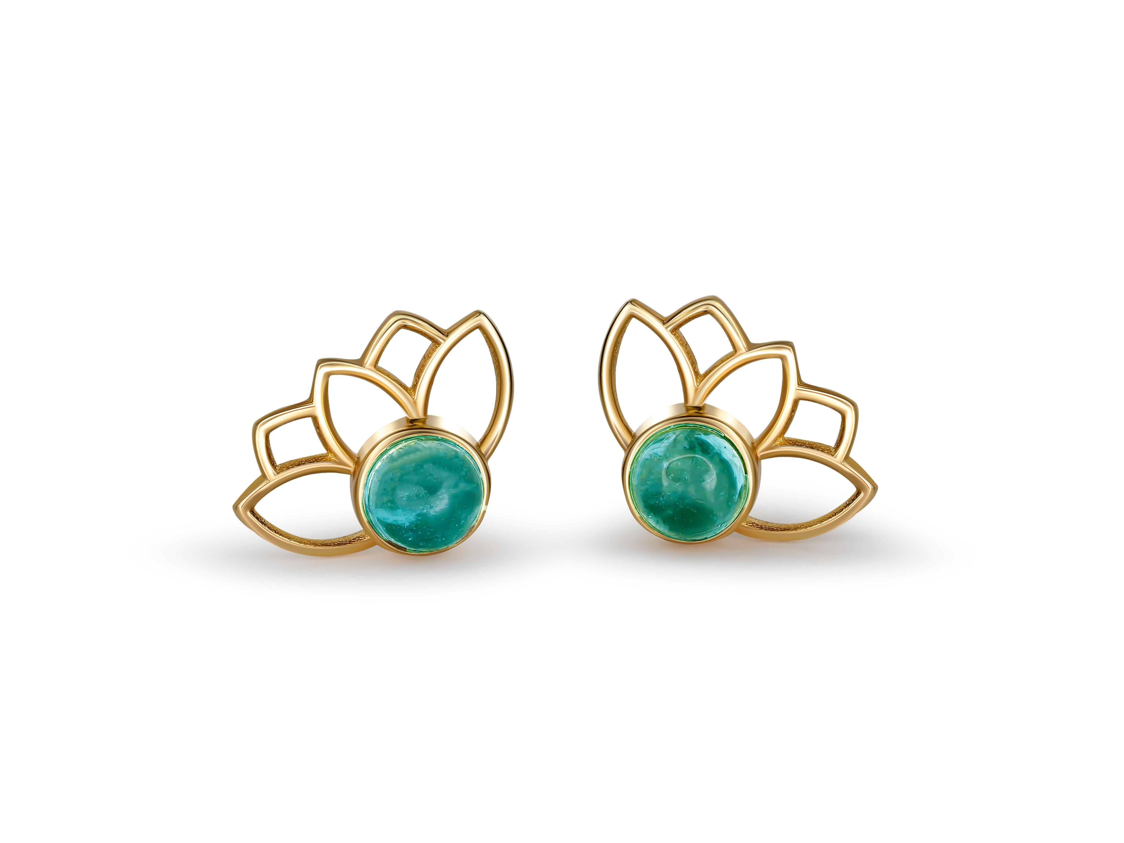 Lotus flower earrings studs in 14k gold. 

Aquamarine cabochon earrings. March birthstone earrings. Blue aquamarine gold earrings studs.

Metal: 14 karat gold
Weight: 1.2 g.
Size: 11.45 x 8.35 mm.

Set with genuine aquamarines: weight - 0.45 ct x 2
