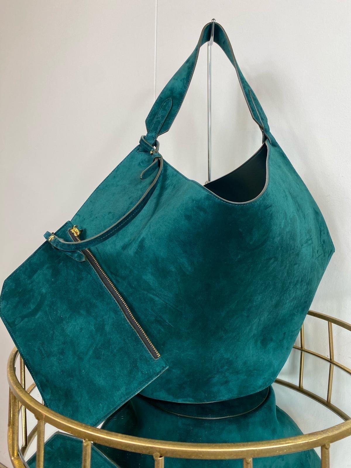 Lotus Khaite bag in petrol-colored suede. In New Condition In Carnate, IT