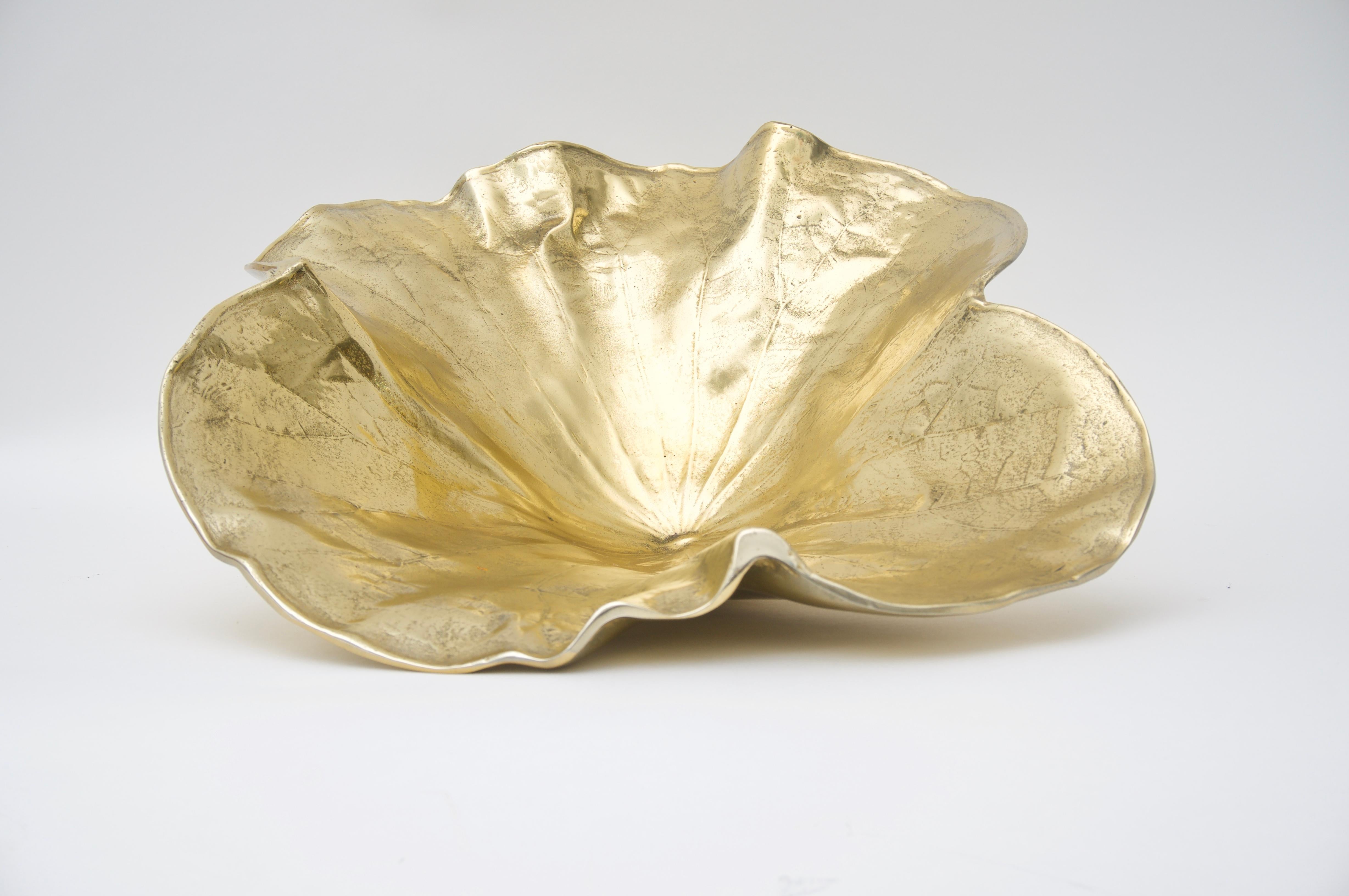This stylish and exotic sculpture of a lotus leaf is by the Norwegian sculptor Oskar J. W. Hansen and it dates to the late 1940s.
 