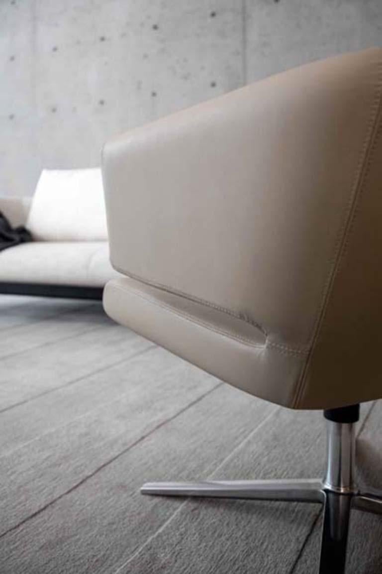 Like a flower opening, the lotus lounge chair is beautiful from all angles. The chair swivels on a steel base to allow maximum flexibility.

Additional information:
- Dimensions: D. 68 x W. 73 x H. 65 cm. 

Lotus leather lounge chair, by Niels