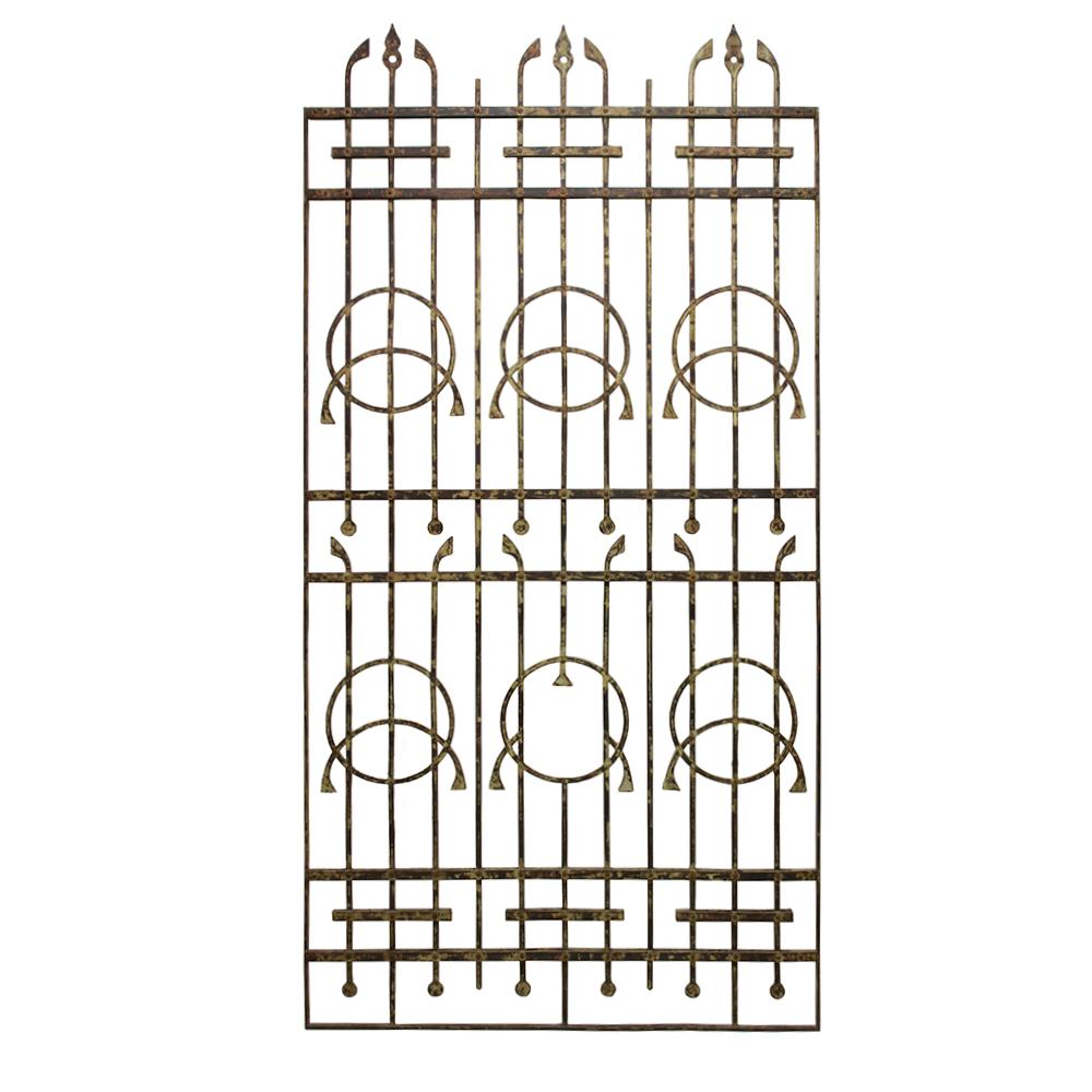 This heavy iron gate has and Art Deco era vintage and some beautiful deco styling. The streamlined lotus pattern is uniquely futuristic and creates an elegant look in any setting.