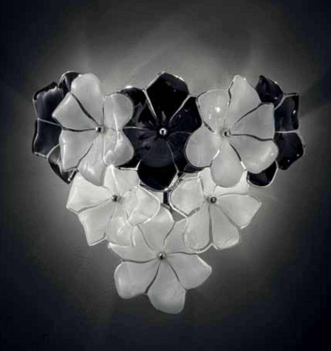 Italian wall light with hand blown white and black Murano lotus flowers mounted chrome finish frame / inspired by Cenedese Made in Italy
Measures: width 12 inches, height 12 inches
2 lights / E12 or E14 type / max 40W each
Order only / this item