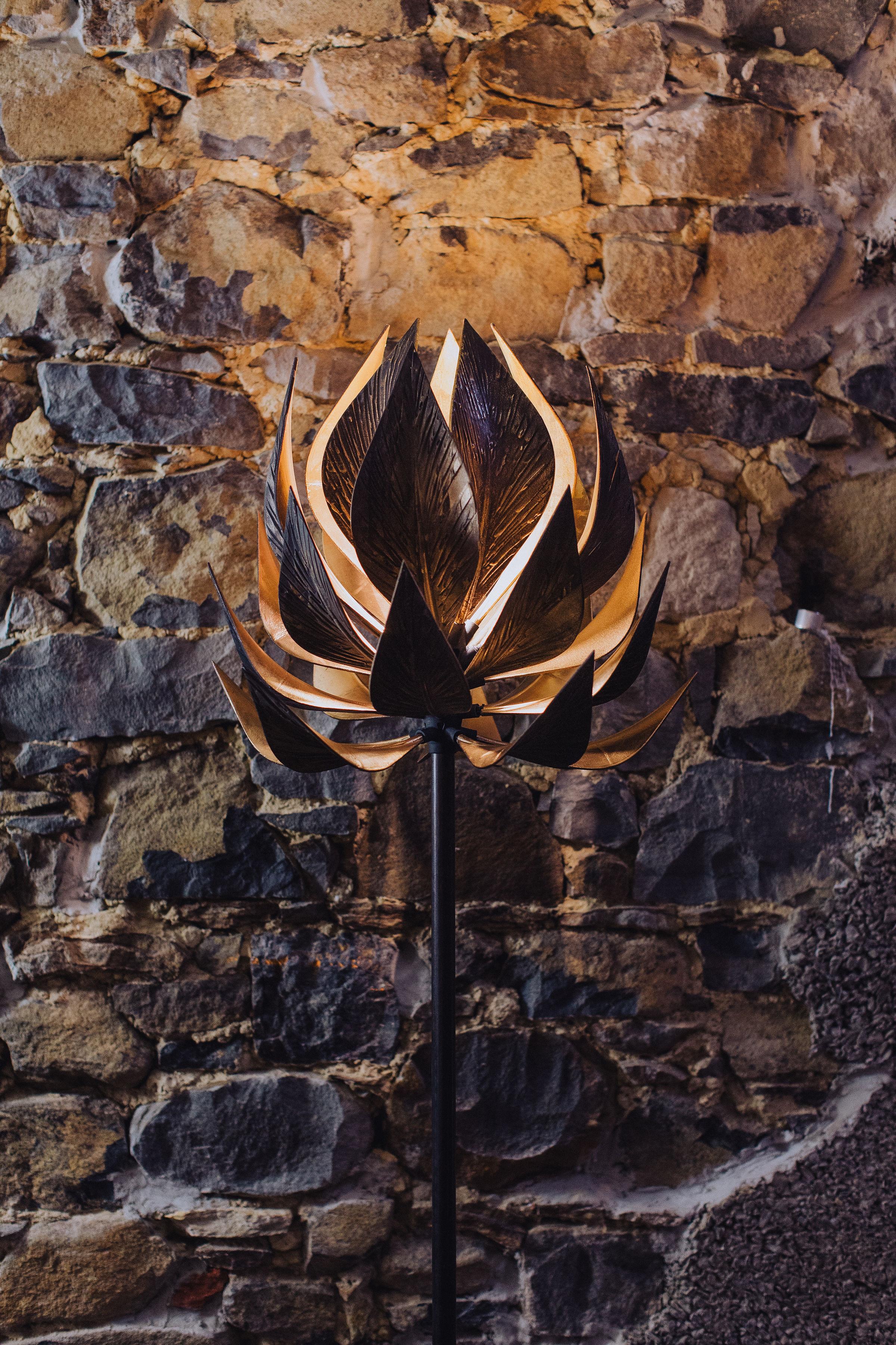 Combining the highest quality materials, the Lotus Standing Light boasts a harmonious blend of ABS polymer and electro-plated bronze for each of the 25 leaves, infusing it with a luxurious aesthetic that is as eye-catching as it is durable. The cast