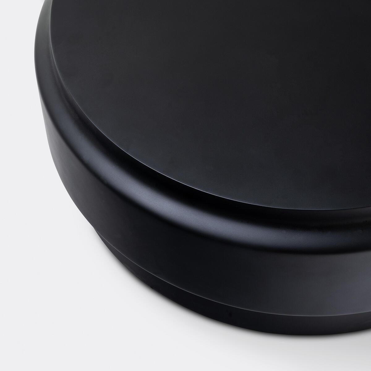 The Lotus Table series is designed to move seamlessly between indoor and outdoor environments. Made of durable fiberglass-reinforced concrete, each drum-like design adds color, geometry and versatile function to seating areas. While each table