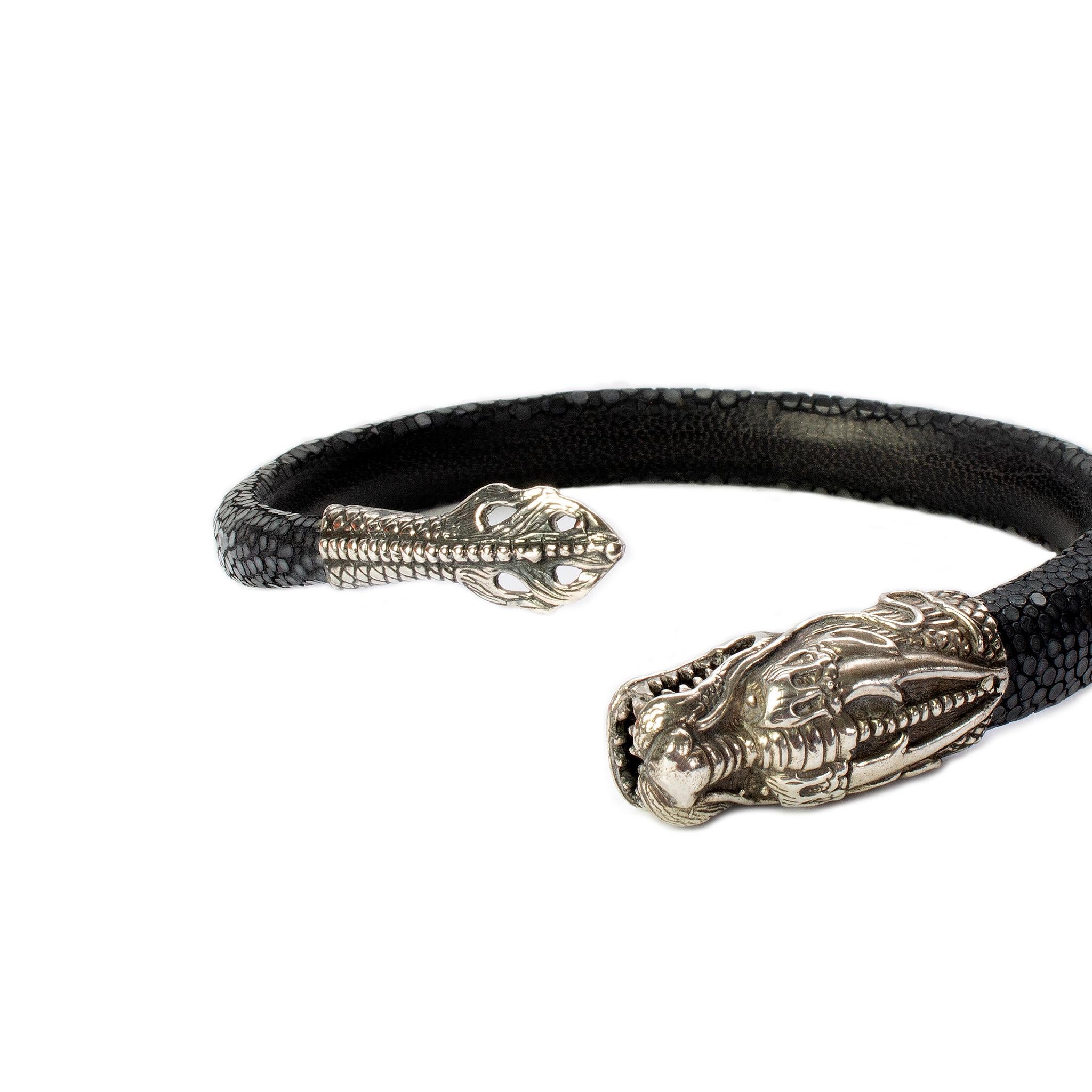 Product Details: Rare - Sterling Silver ‘Dragon’ Bracelet / Stingray Leather Outer / Leather Inlay - Adjustable Fit
Artist: Lou Guerin 
Fabric Content: Silver Plate / Stingray Leather / Leather Lining
Condition: Rare Collectors Piece - New
Length: