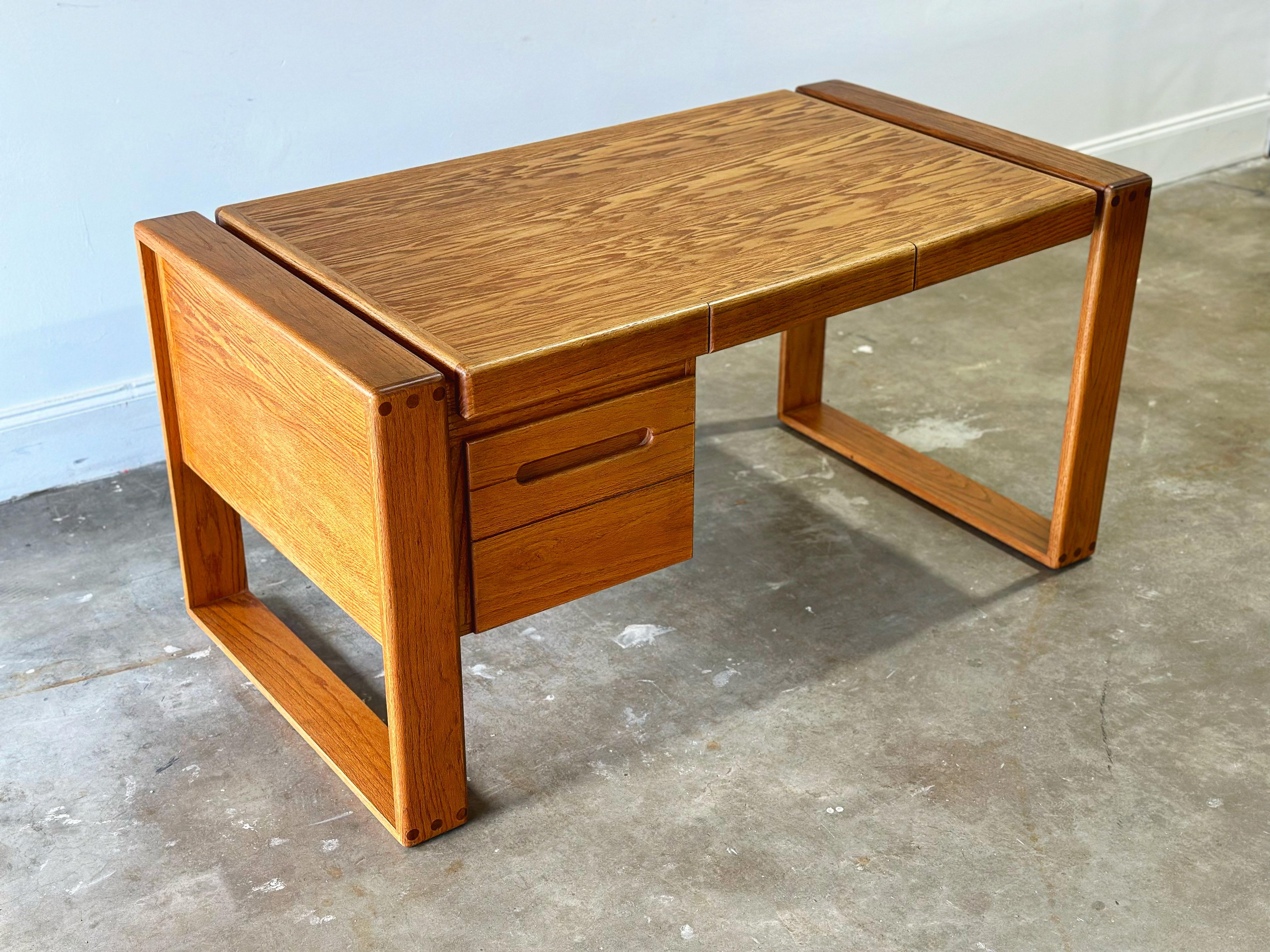 Lou Hodges handcrafted solid oak desk for California Design Group, signed and date 1980. This piece has been professionally restored and attended to by our team - it is in excellent condition and is ready for use.

.