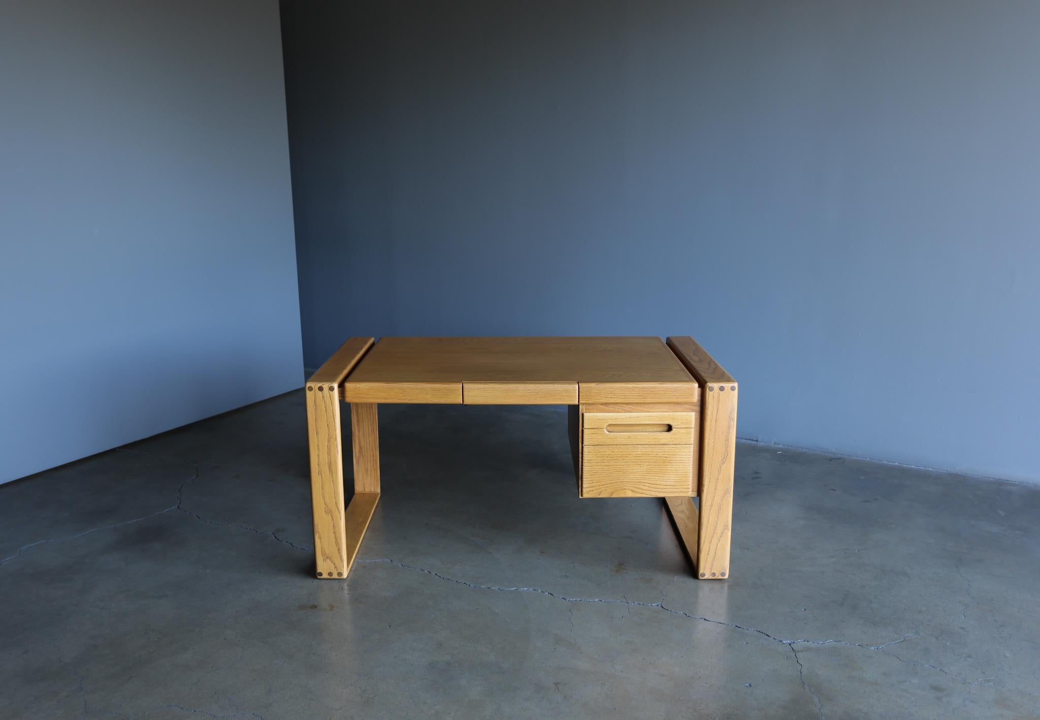 Lou Hodges handcrafted solid oak desk for California Design Group, 1978. This piece has been professionally restored.