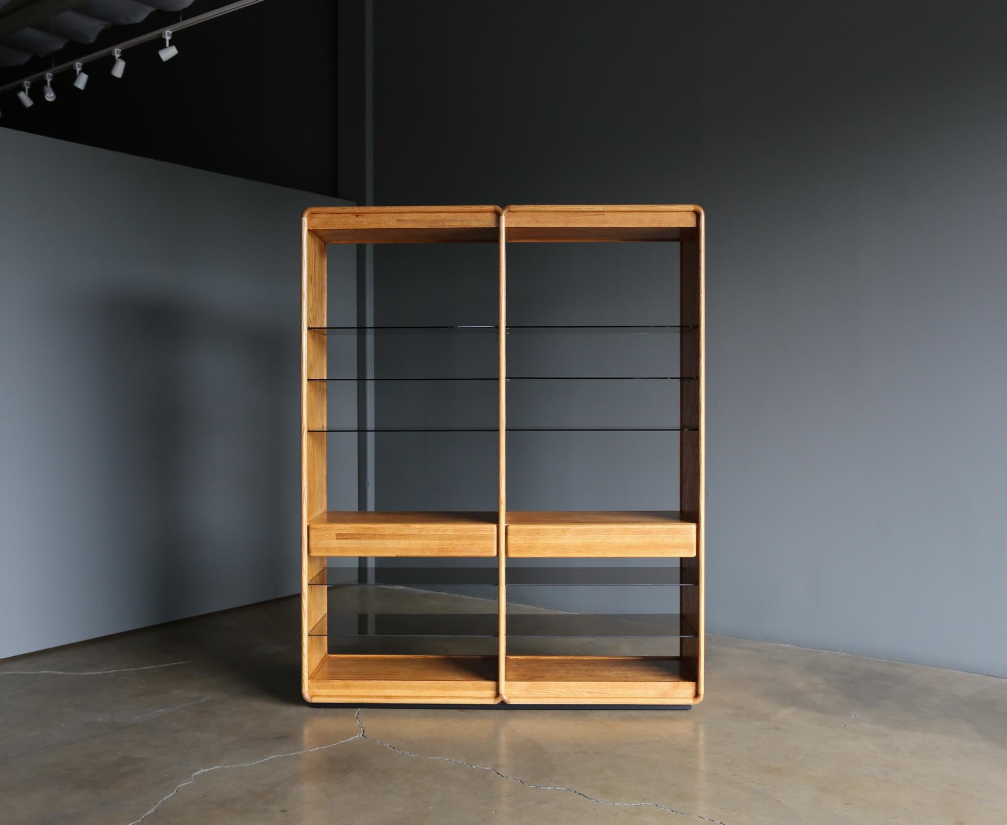 Lou Hodges handcrafted oak & smoked glass Etagere / bookcase / wall Unit for California Design Group, circa 1975. The oak has been professionally restored.
