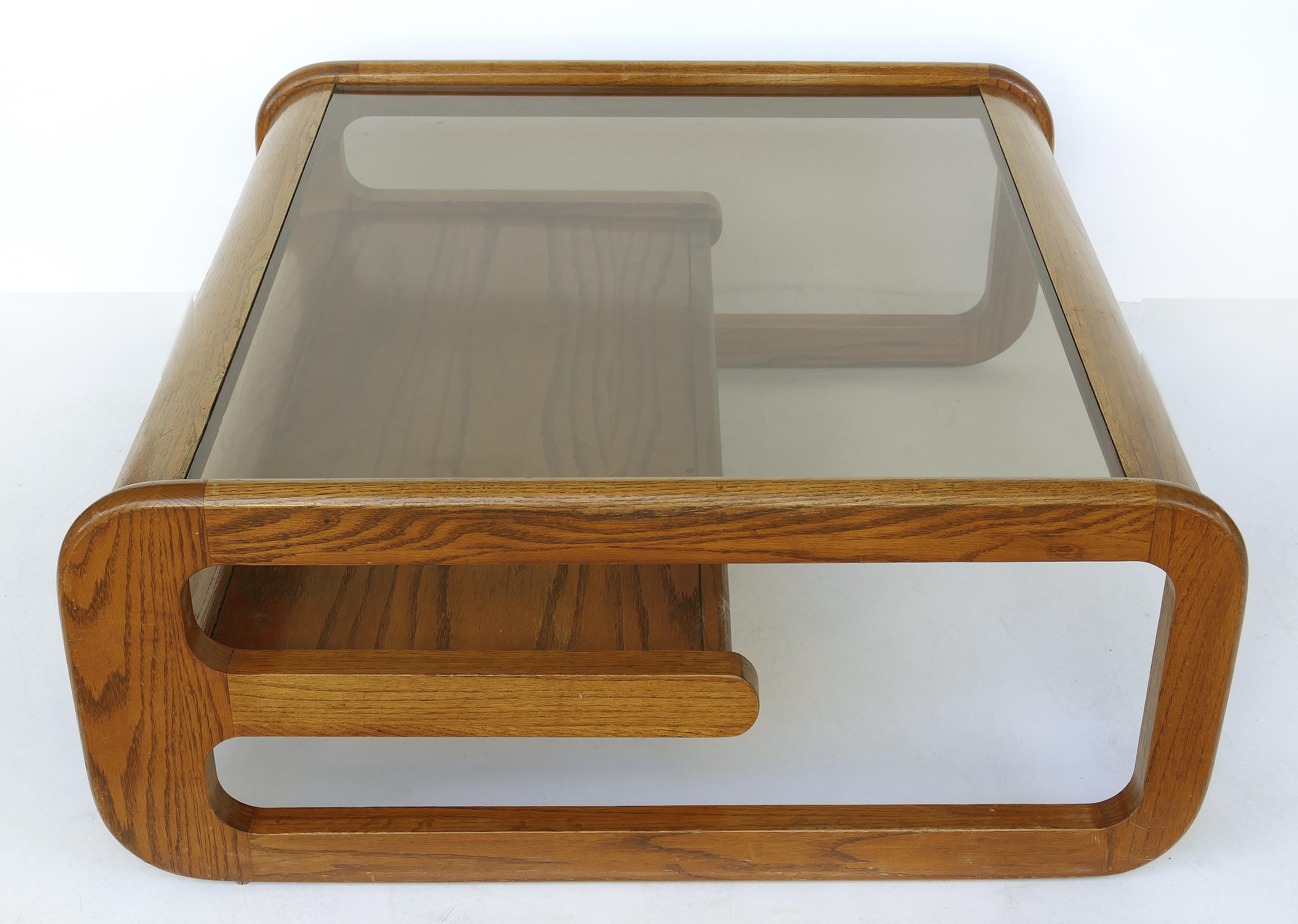 Lou Hodges Mid-Century Modern California coffee table with inset glass

Offered for sale is a Lou Hodges (1937-2003) Mid-Century Modern two-tiered California coffee table with inset glass top. Lou Hodges was an important figure in the history of