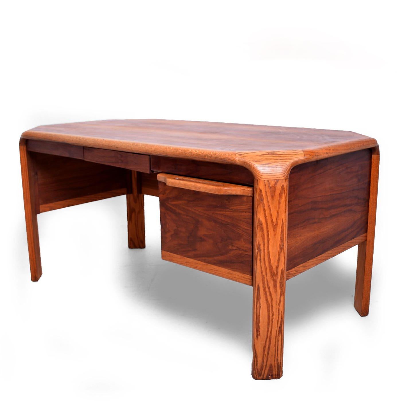 For your consideration a Mid-Century Modern desk attributed to Lou Hodges.

Walnut with oak wood. Features one small pull-out drawer and a large file drawer. 

Unmarked, USA, circa late 1960s. California modern.

Measures: 29 1/4