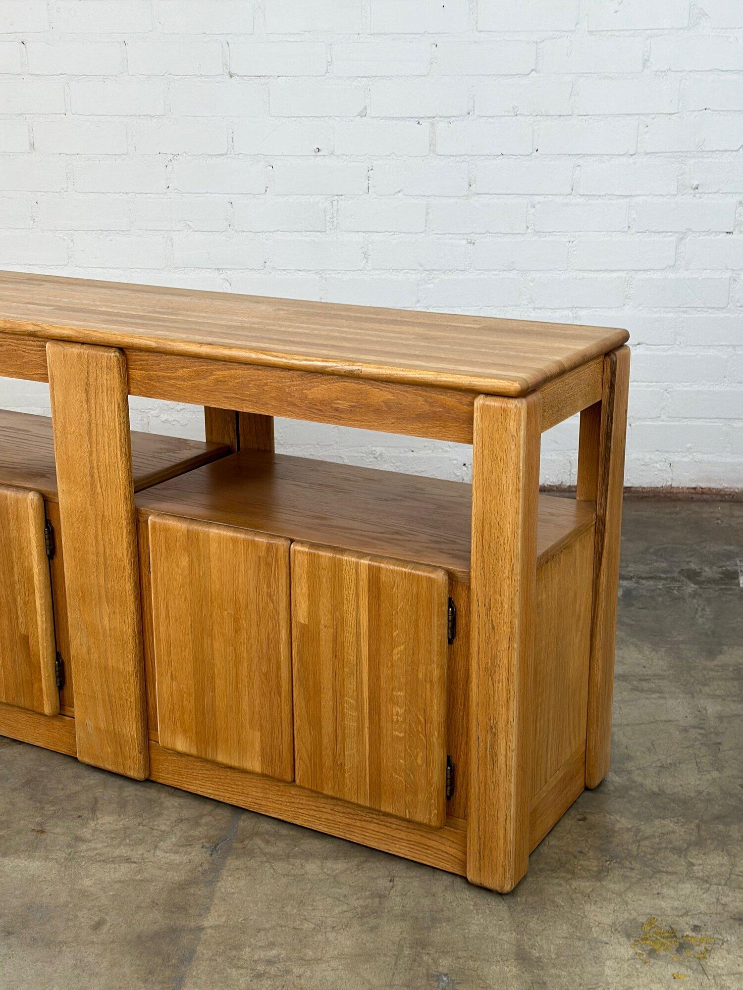 W60 D17 H31

Restored media credenza in structurally sound fully functional condition. Item is made with a majority of solid oak very minimal areas have veneer. Item is finished on all side and shows very well.