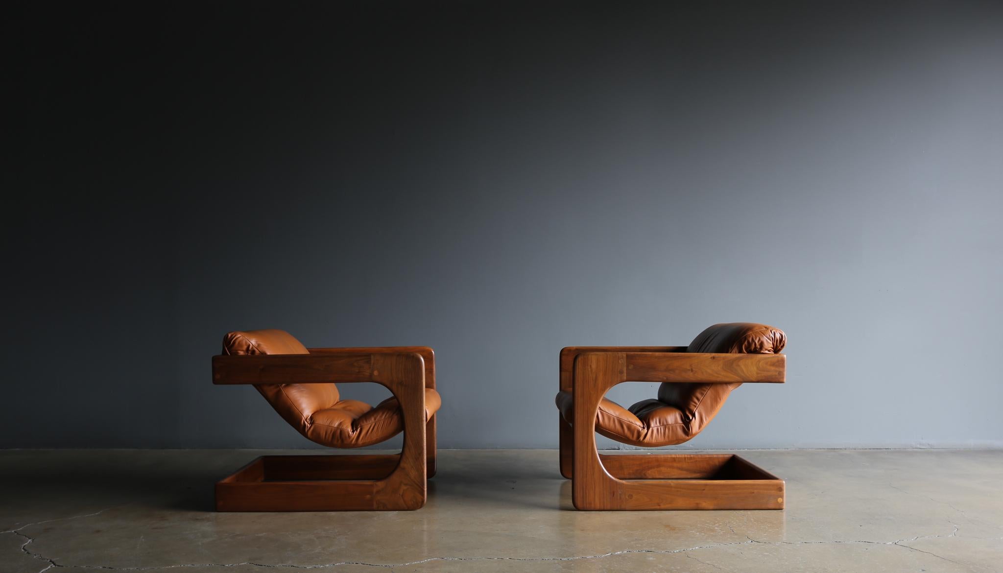 Lou Hodges Walnut & Leather Lounge Chairs for California Design Group, 1970's.  The walnut frames have been professionally restored. 