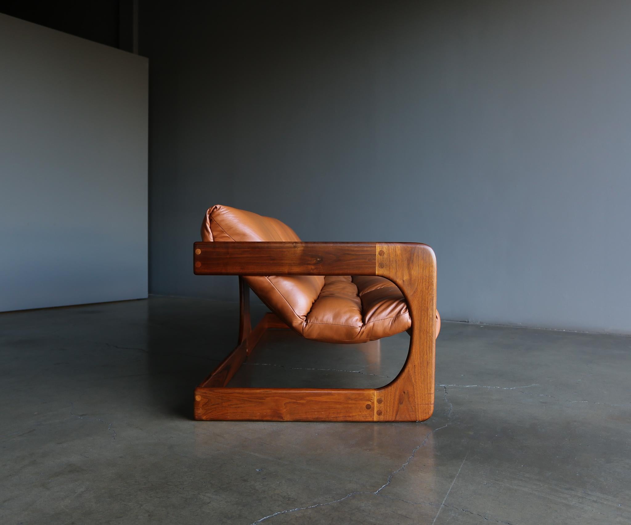 Lou Hodges walnut and leather sofa for California Design Group, 1970s.