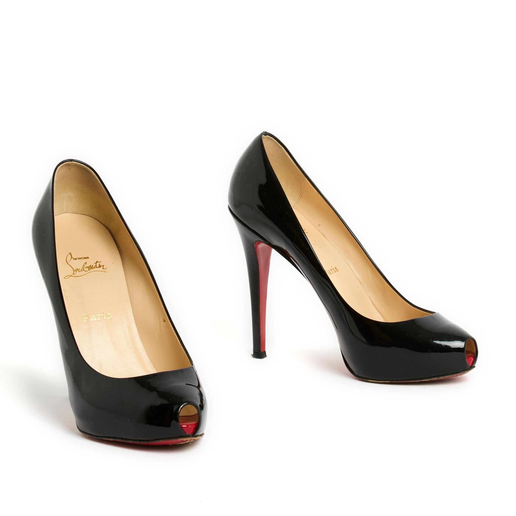 Christian Louboutin pumps, New Very Privé model, in black patent leather, mini open toe and small platform in front, stiletto heel, lining, leather inner and outer soles. Size 39.5EU or UK6 and US8.5, 12 cm heel. The pumps have been worn but they