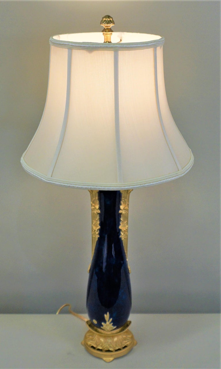 A fantastic Art Nouveau porcelain vase on bronze bases by Paul Francoise Louchet with exceptional glaze that has been customized as a table lamp and fitted with a silk lampshade.