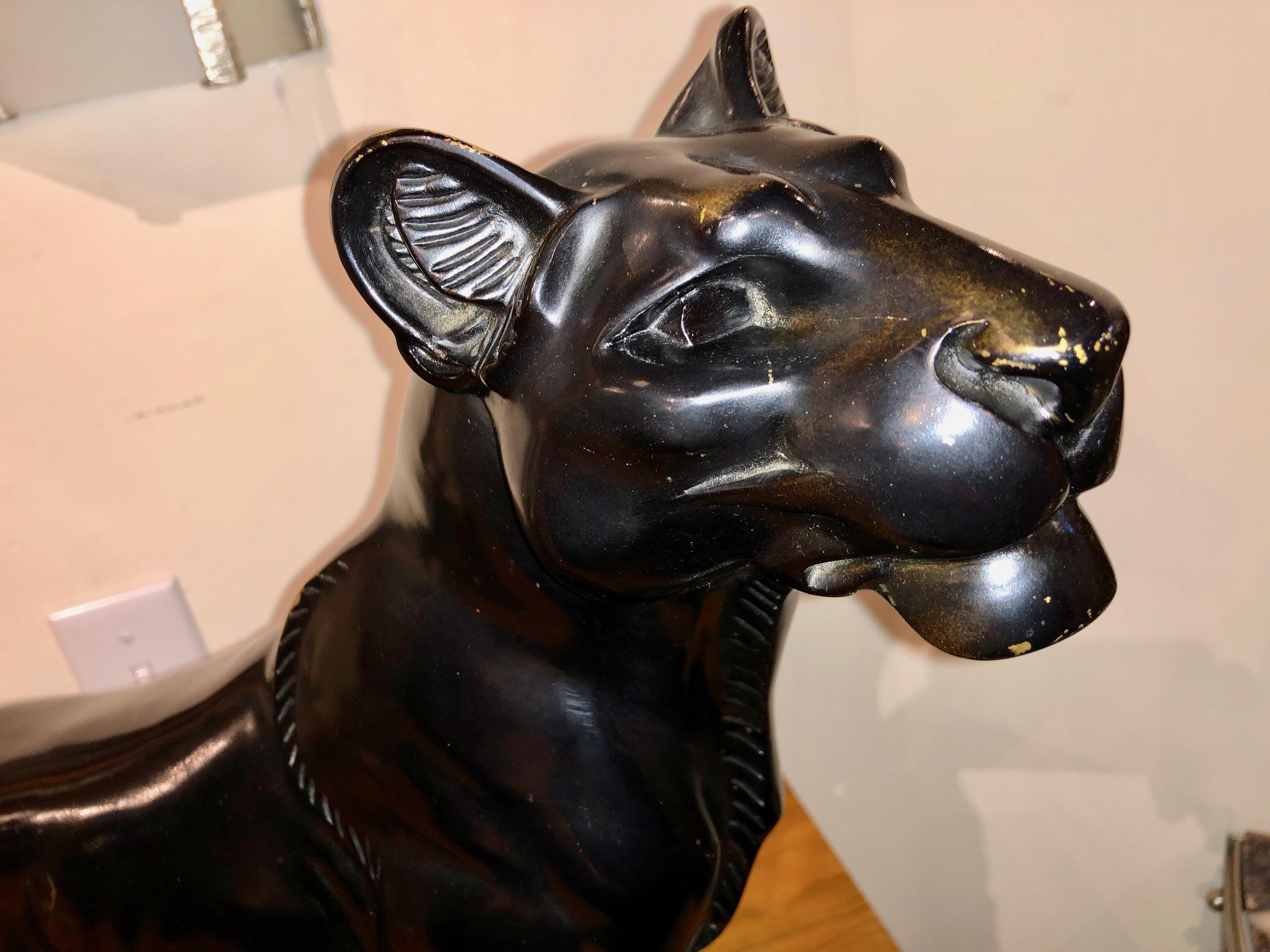 Extremely rare black panther bronze sculpture by Louis Albert Carvin circa 1930. This is an example of pure cubist style in black patina, portraying a panther standing tall and proud. This fiercely cast feline has detailed musculature and sleek