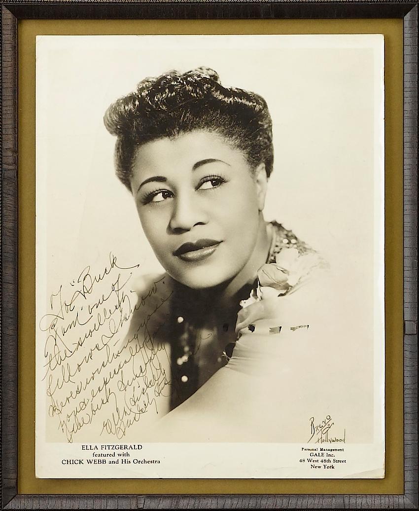 Presented is a custom-built collage featuring elements relating to jazz legends Louis Armstrong and Ella Fitzgerald. The featured items include a Louis Armstrong signed publicity photo, an Ella Fitzgerald signed and inscribed publicity photo, a