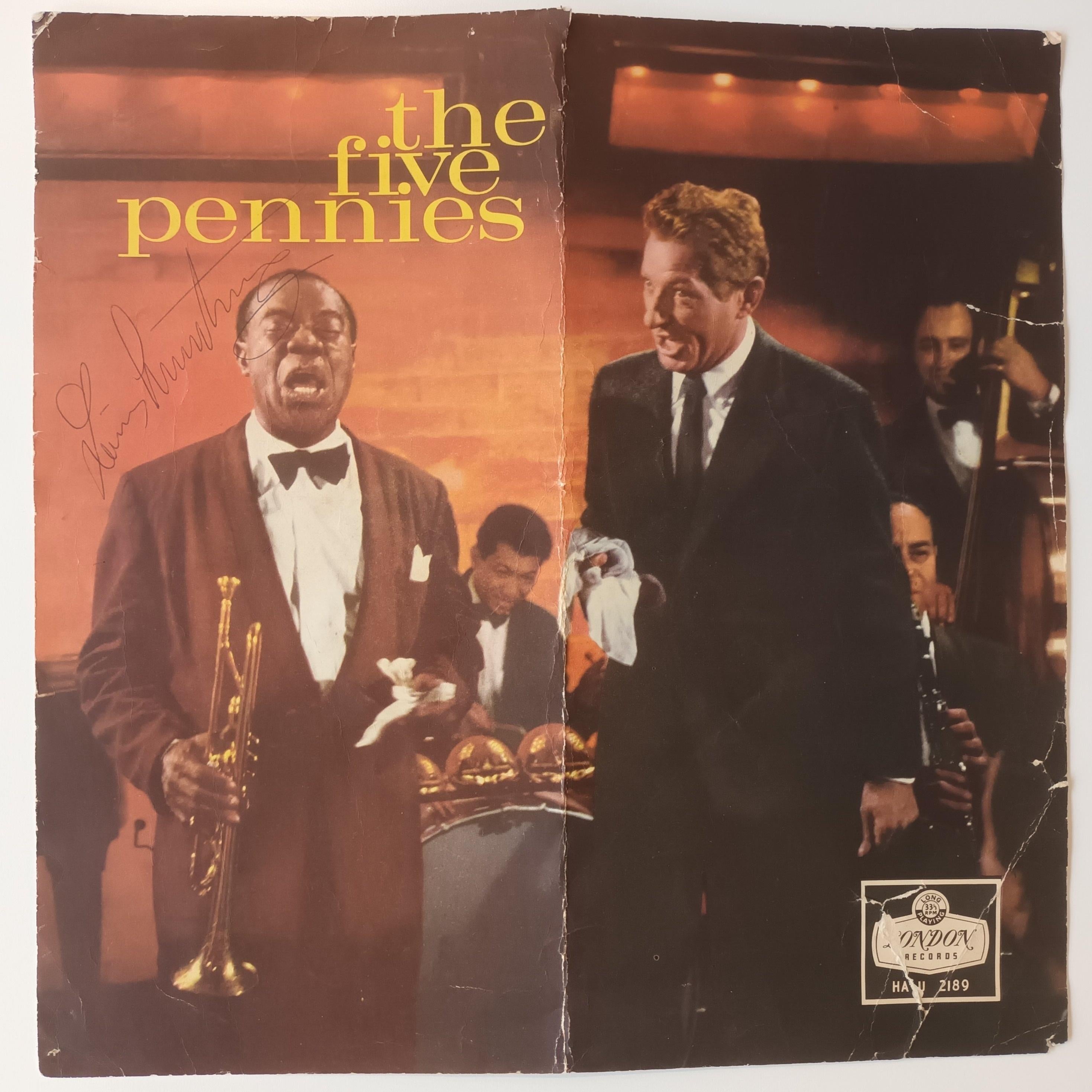 A superb Louis Armstrong autograph
Featured on a 12 by 12 inch image of Armstrong, alongside actor Danny Kaye, from 1959 film The Five Pennies 

Armstrong has signed his name handsomely in black ink.

The item may have originally been inserted