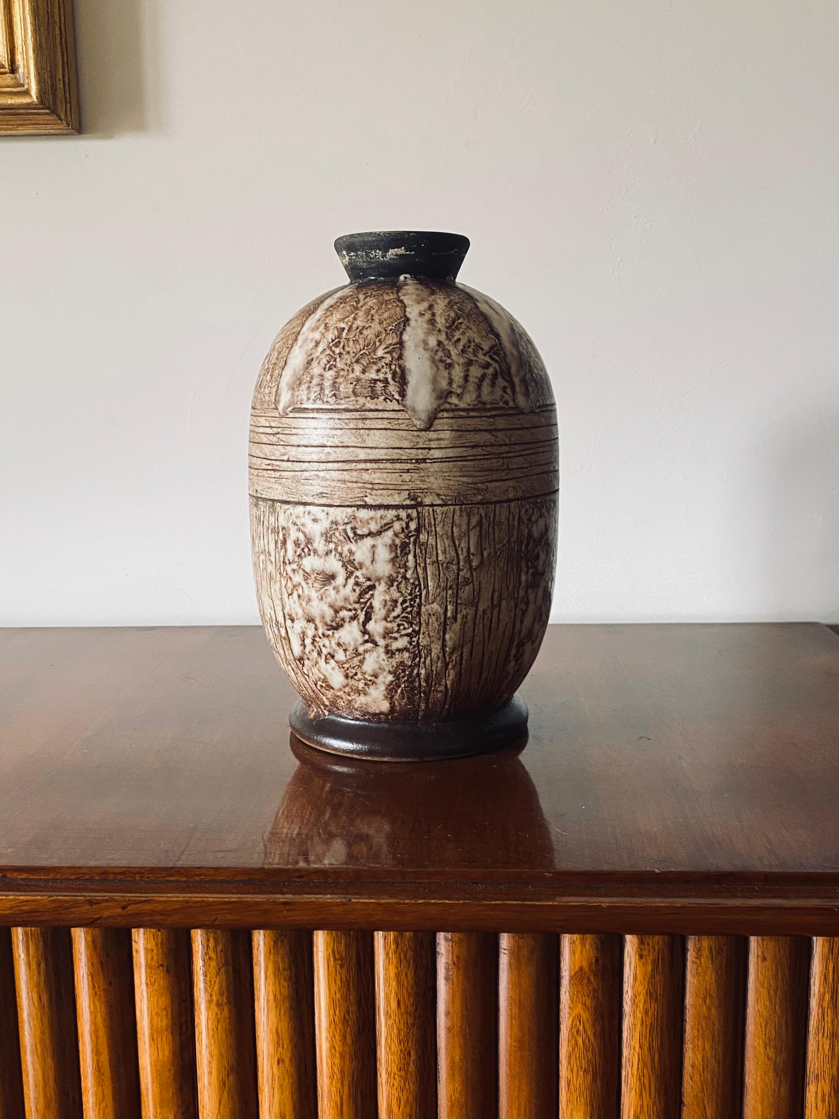 Art Deco unique ceramic vase

Louis Auguste Dage, Faïencerie de l’Adour France 1930s

33 cm H - diam. 20 cm

Signed on the base L.Dage

Conditions: excellent, no defects