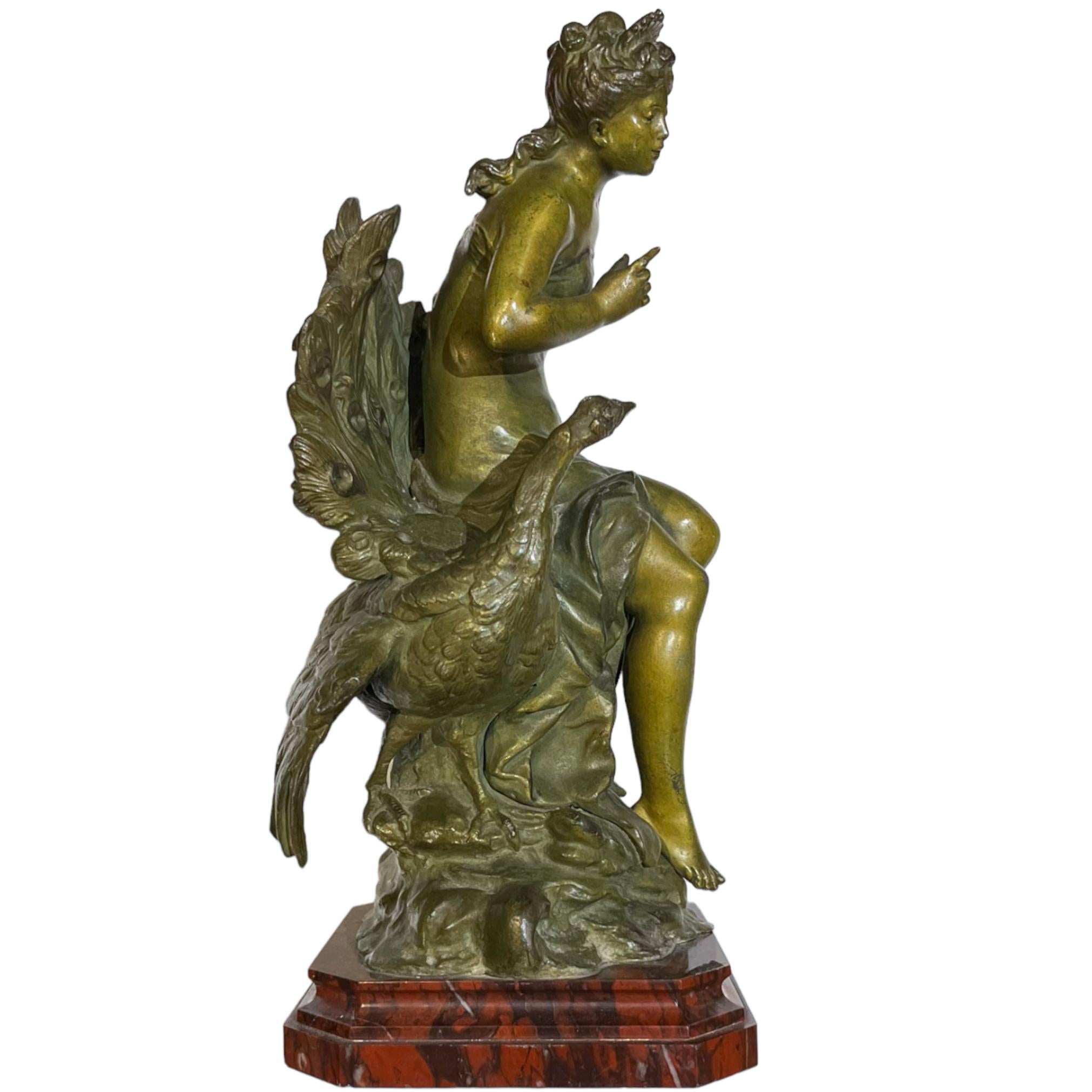 A Fine French Patinated Bronze Figure of Young Maiden sitting beside a Peacock surmounted atop a rouge marble plinth by Auguste Moreau.

Perfect size for a desk or dresser, or mantle ornament.

Maker: Auguste Moreau (1834-1917)
Auguste Moreau (1834