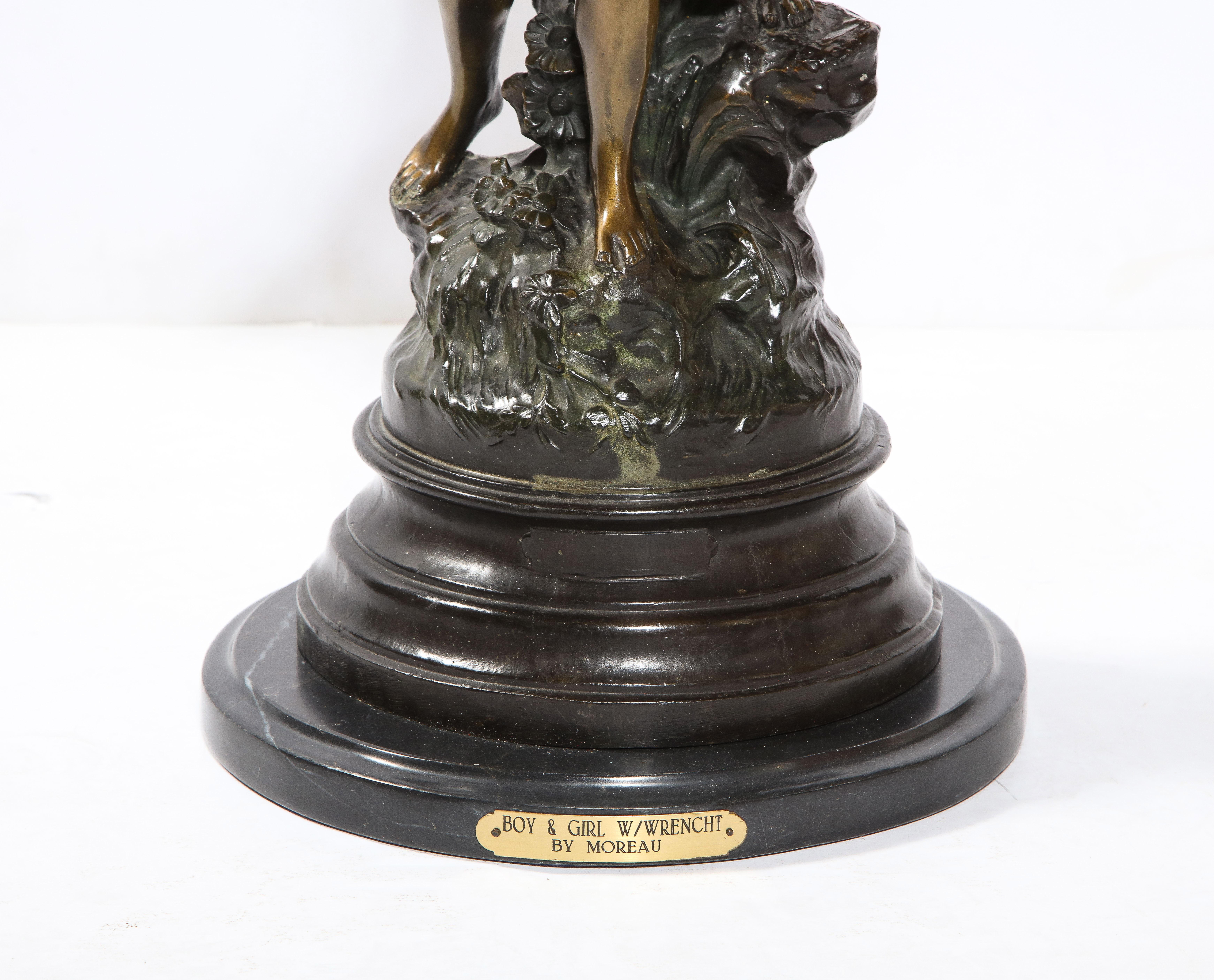 The two patina bronze sculpture by Auguste Moreau showing a winged boy with another child. Set on a stepped black marble base.
Signed AUG. Moreau in the casting.