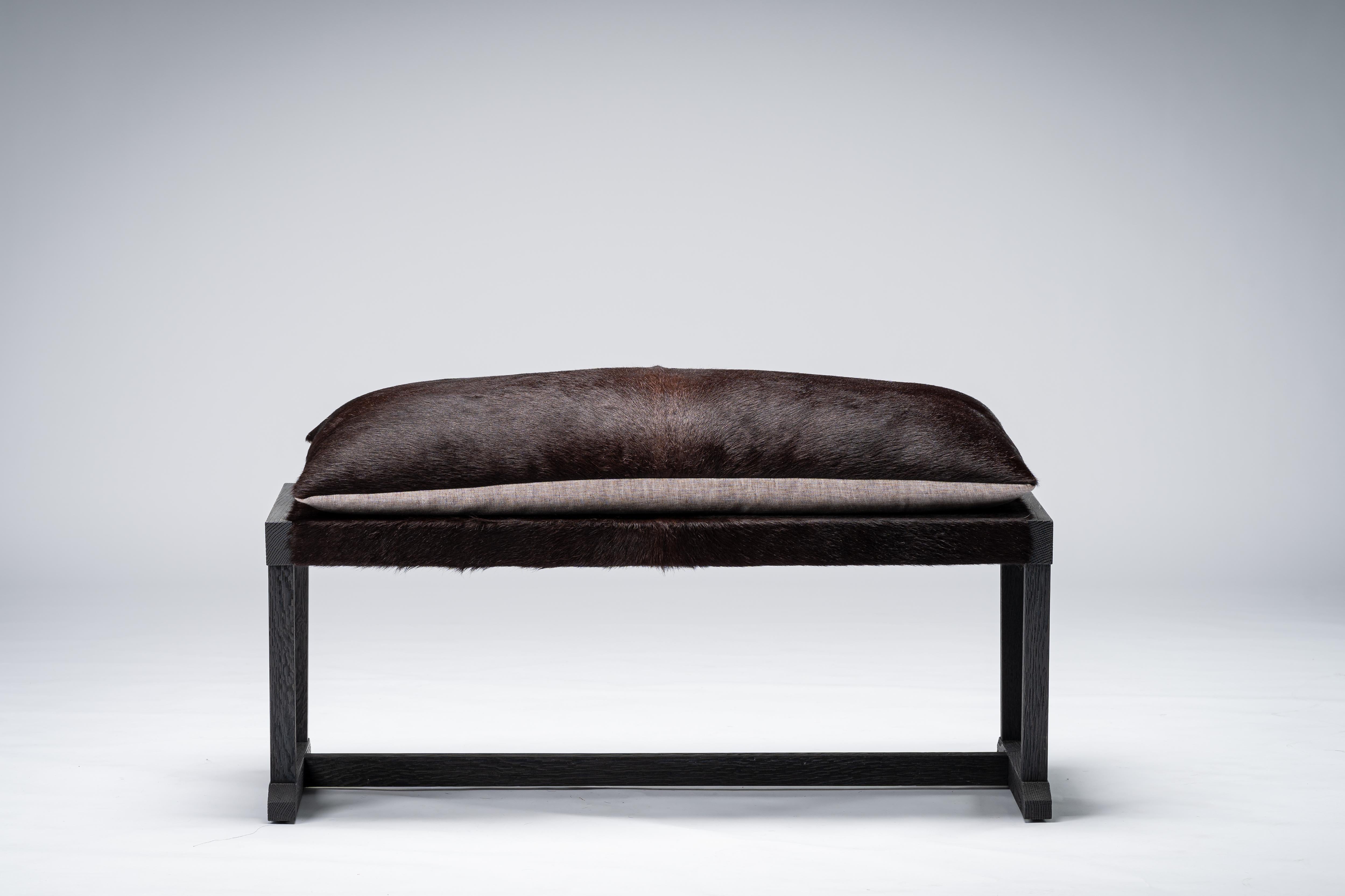 LOUIS bench by Mandy Graham

LOUIS
L02 - Bench
Walnut/sandblasted oak with hairy cowhide loose cushion seat
Measures: 42