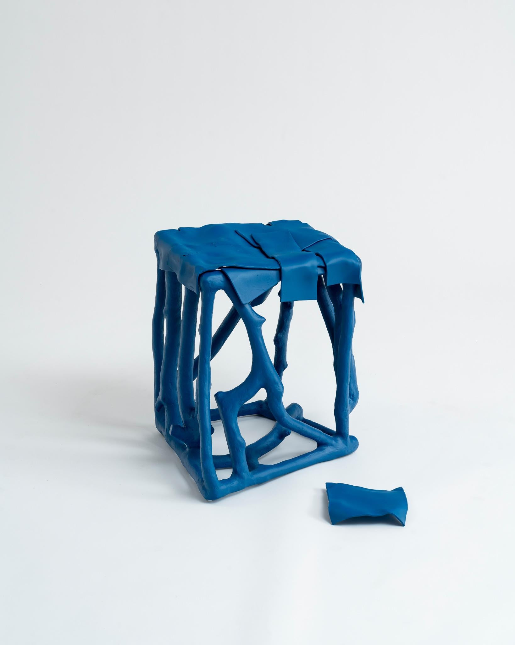 This eclectic, one-off azure-blue decorative accent table or stool is made by French multidisciplinary artist-designer Louis Bressolles. The entirely unique sculptural object is constructed of interlocking pieces of reclaimed tree branches and