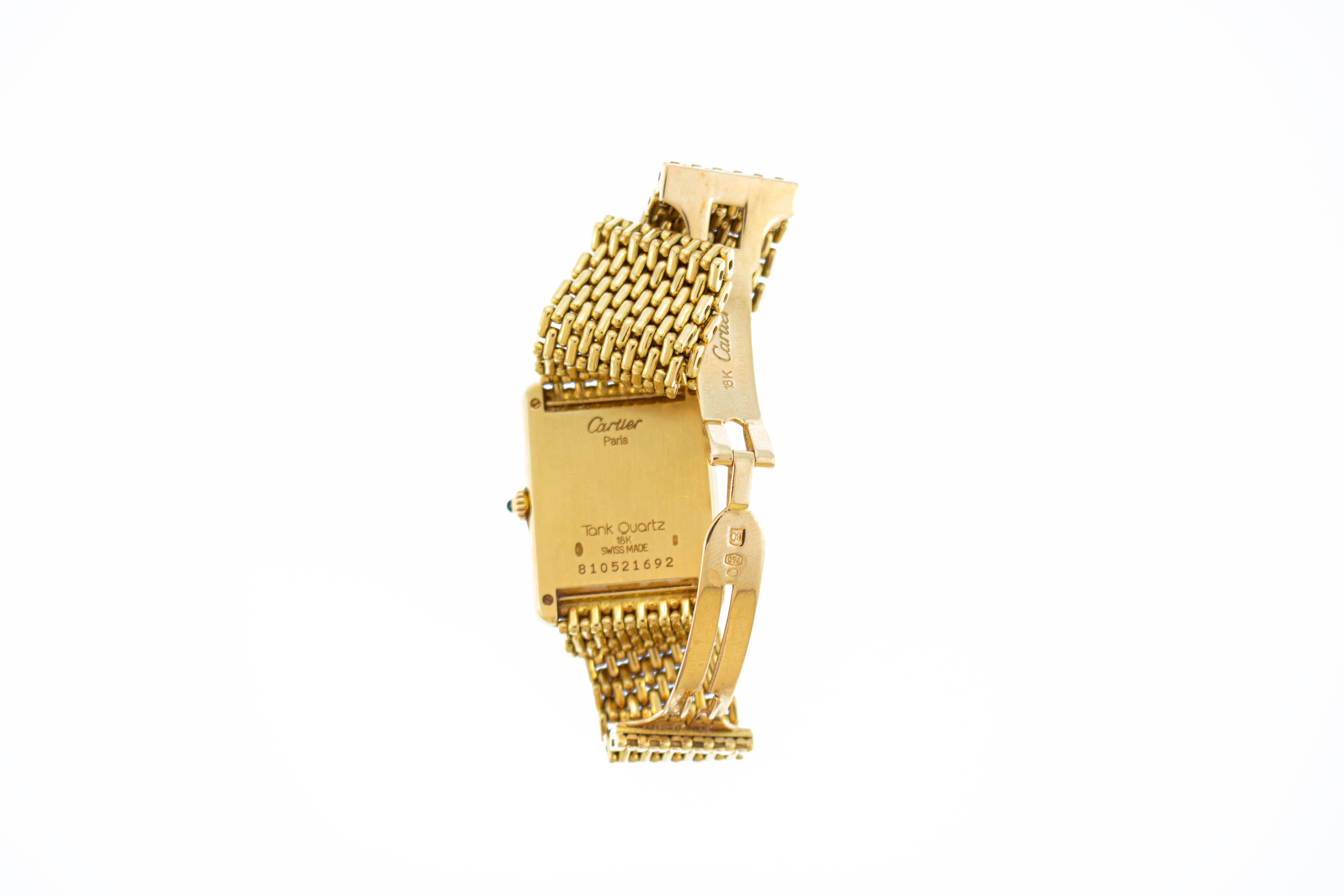 Beautiful 18k gold quartz Cartier tank watch with the gold jubilee band. Including movement watch weighs a total of 70.25 grams. Watch face 25.4mm by 20.32mm